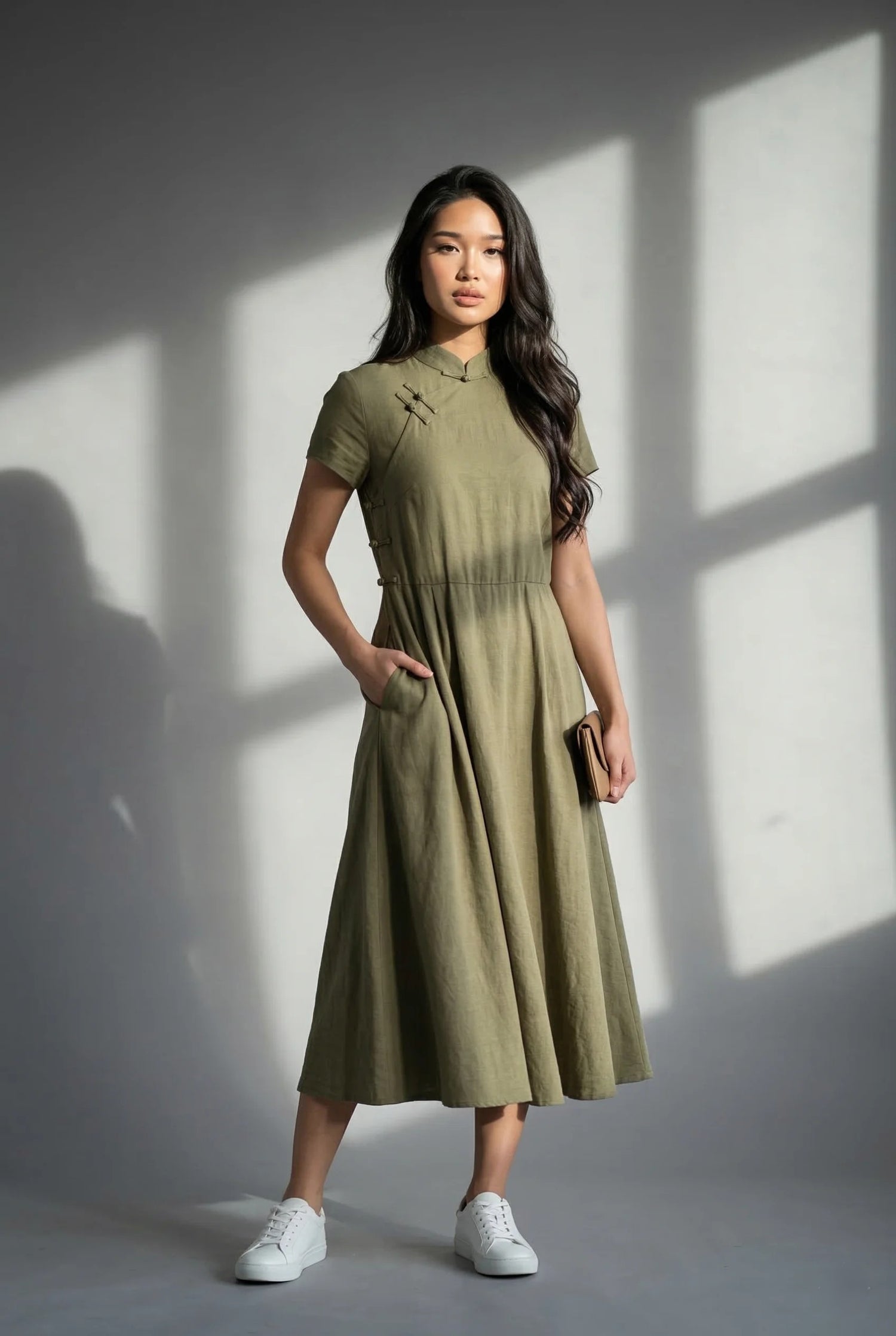 Modern olive green Chinese costume for female daily wear, featuring a lower collar height and A-line skirt for urban movement