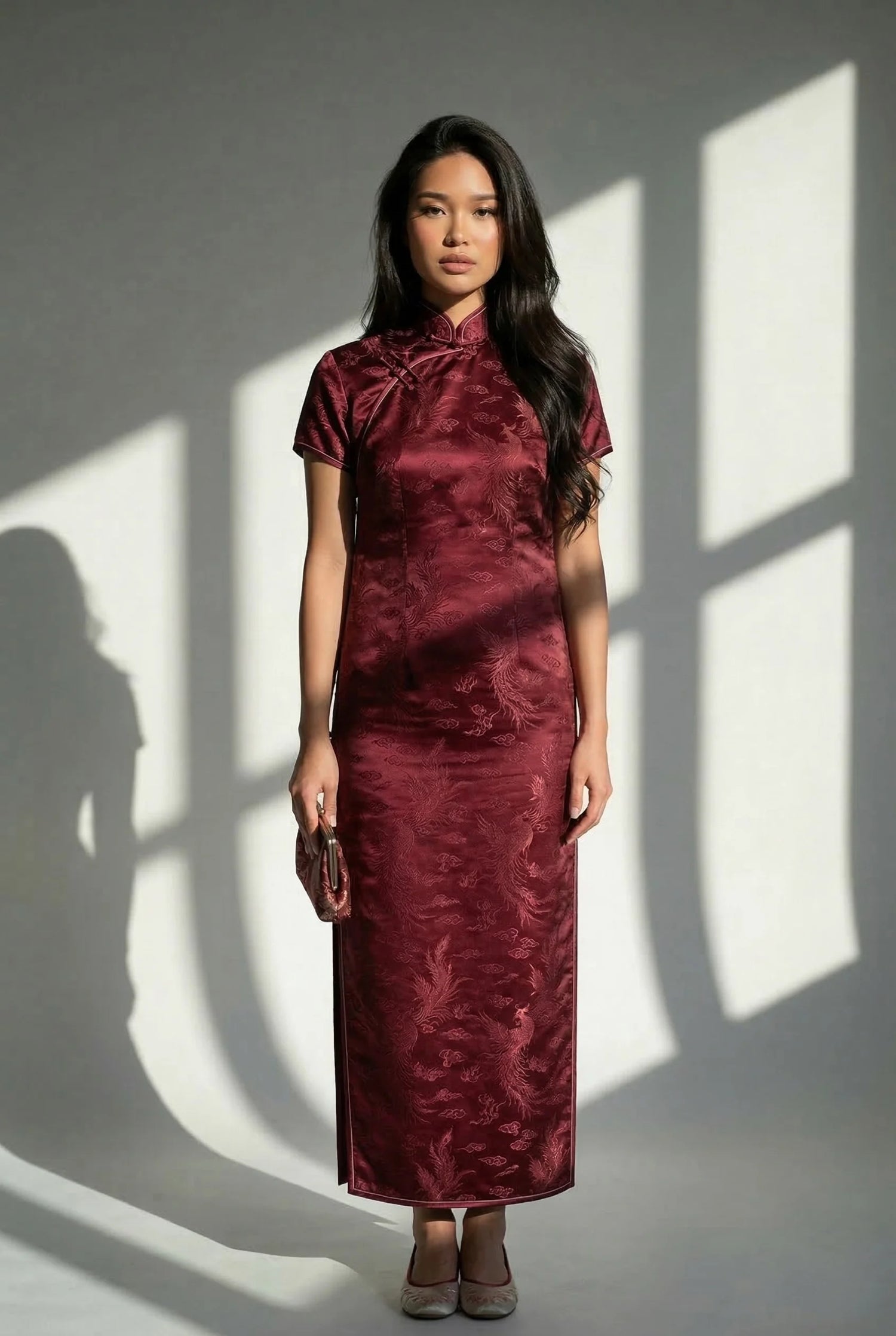 Authentic burgundy vintage cheongsam dress featuring an iconic straight-line profile, crafted from high-density heritage fabric by Maison Hua