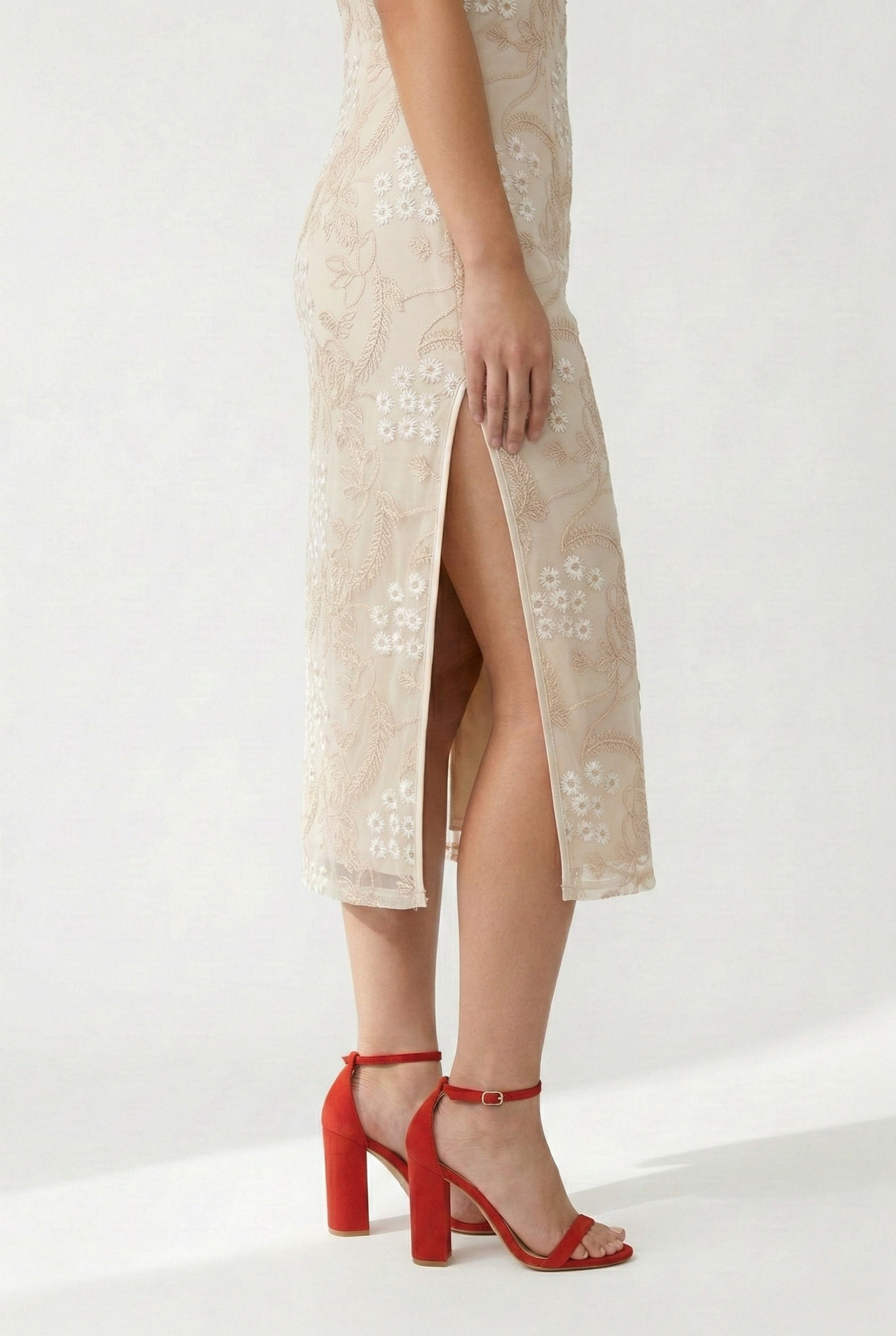Beige qipao detail, high side slit and embroidery