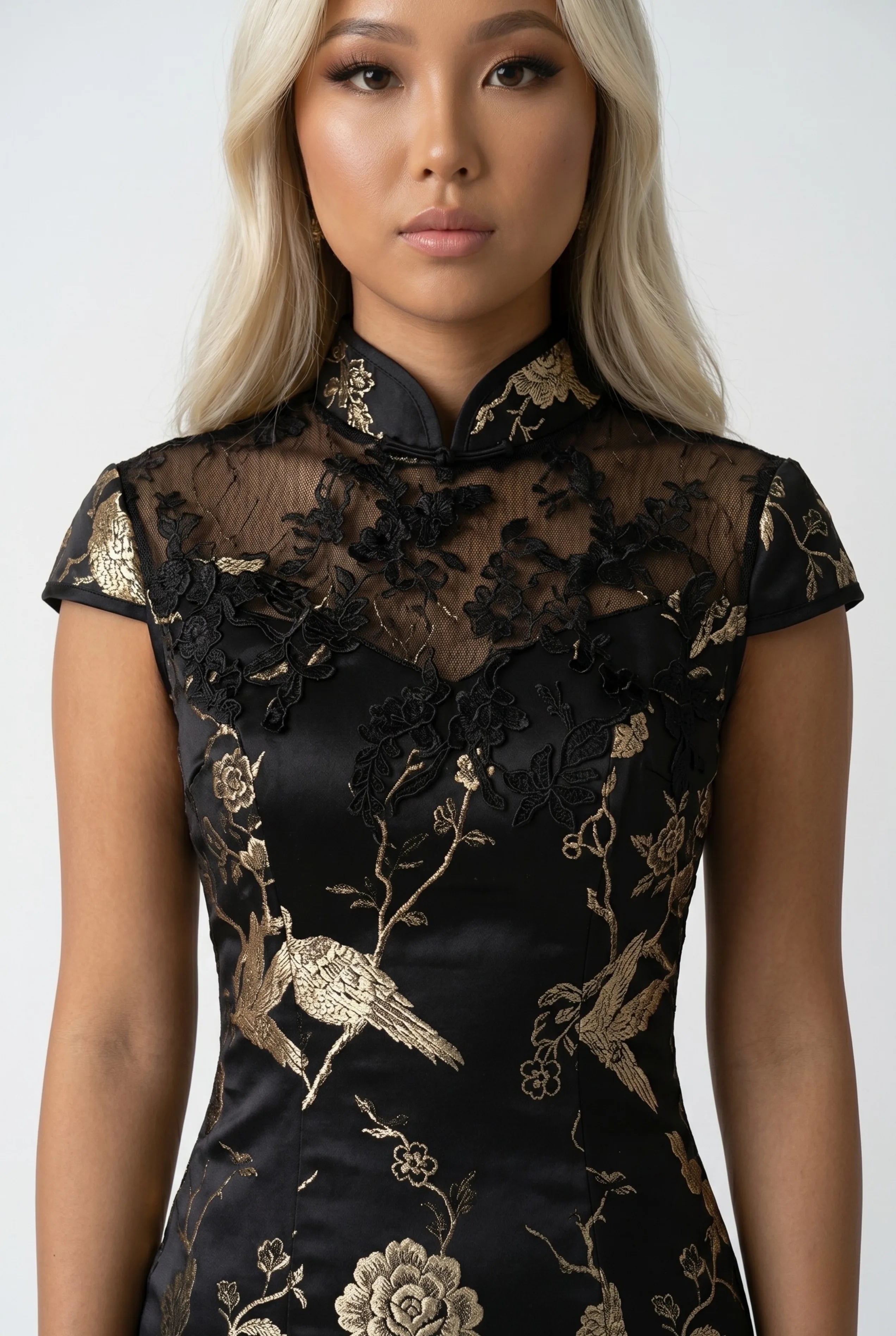 Close-up front view highlighting the sheer lace halter-style yoke, mandarin collar, and gold embroidery