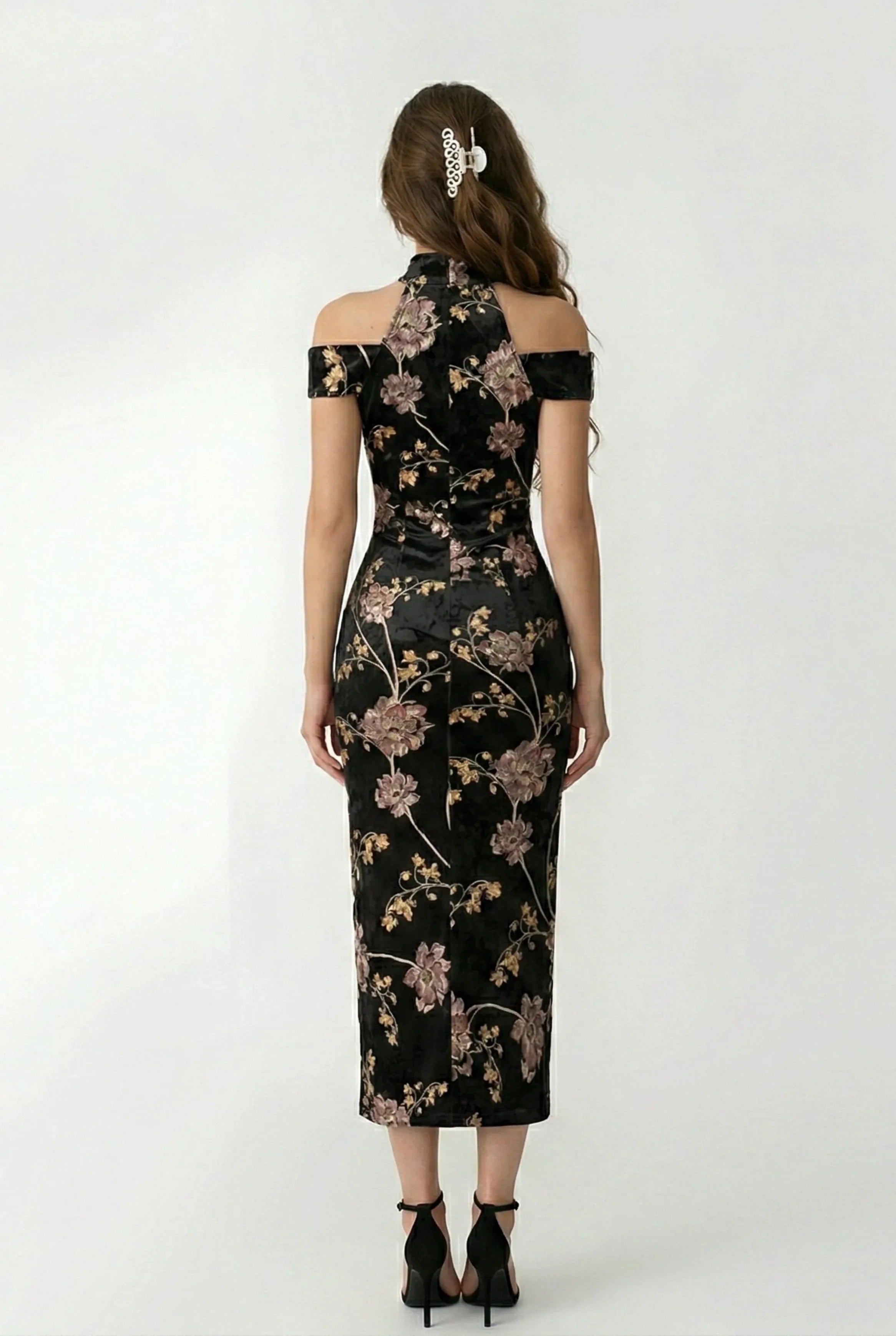 Fitted back view of a black floral halter-style qipao