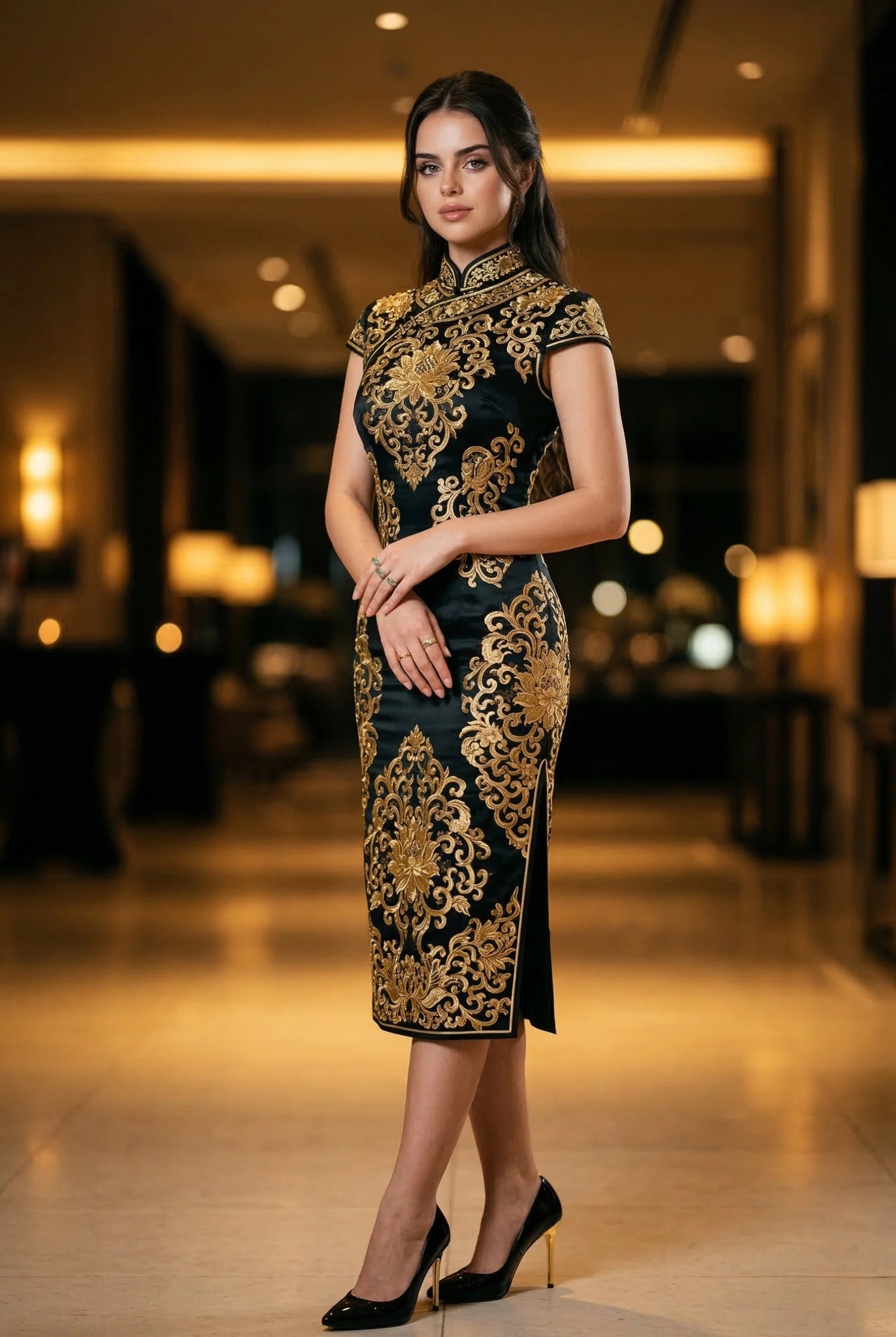 Full-length black and gold cheongsam featuring traditional gold thread floral embroidery on dark silk, designed by Maison Hua for striking evening event style