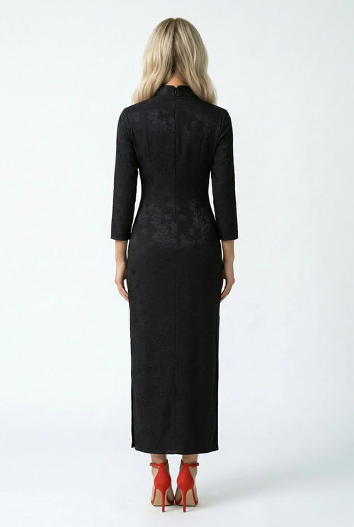 Back full view of the long black qipao, showing its silhouette.