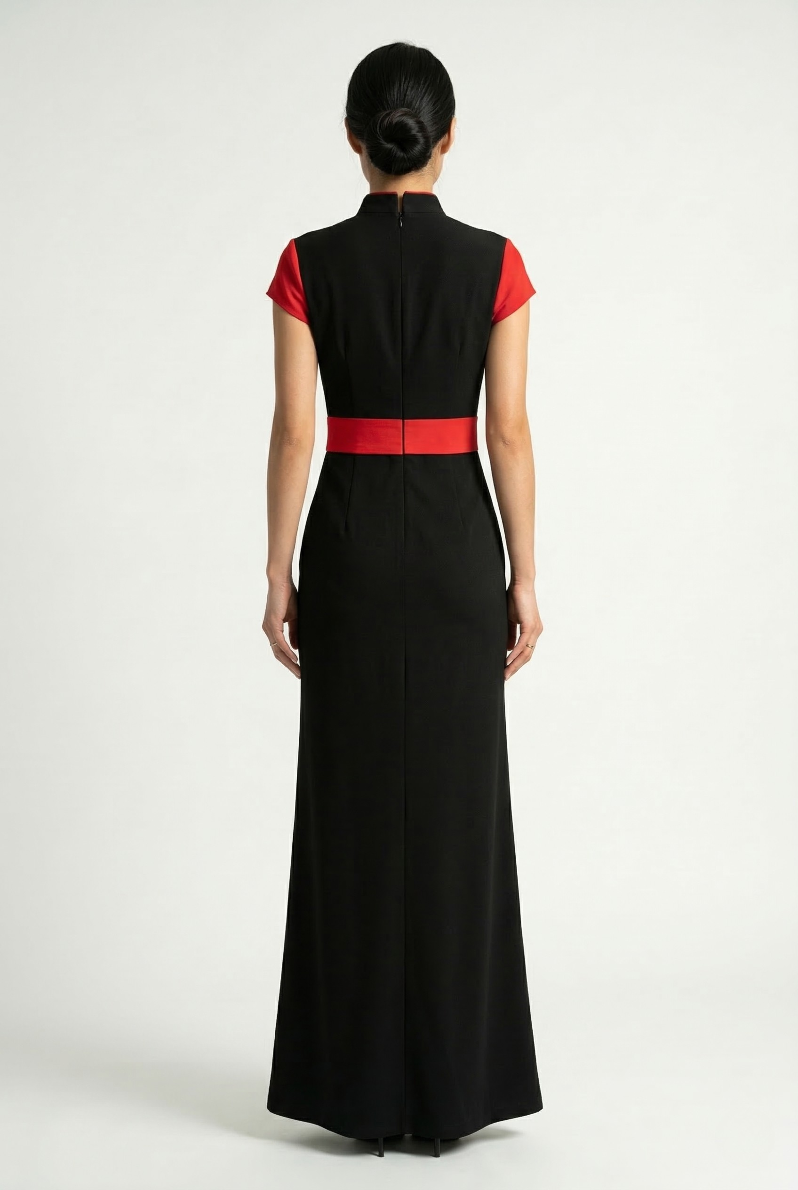 Full back view of a form-fitting long black Cheongsam dress with red accents.