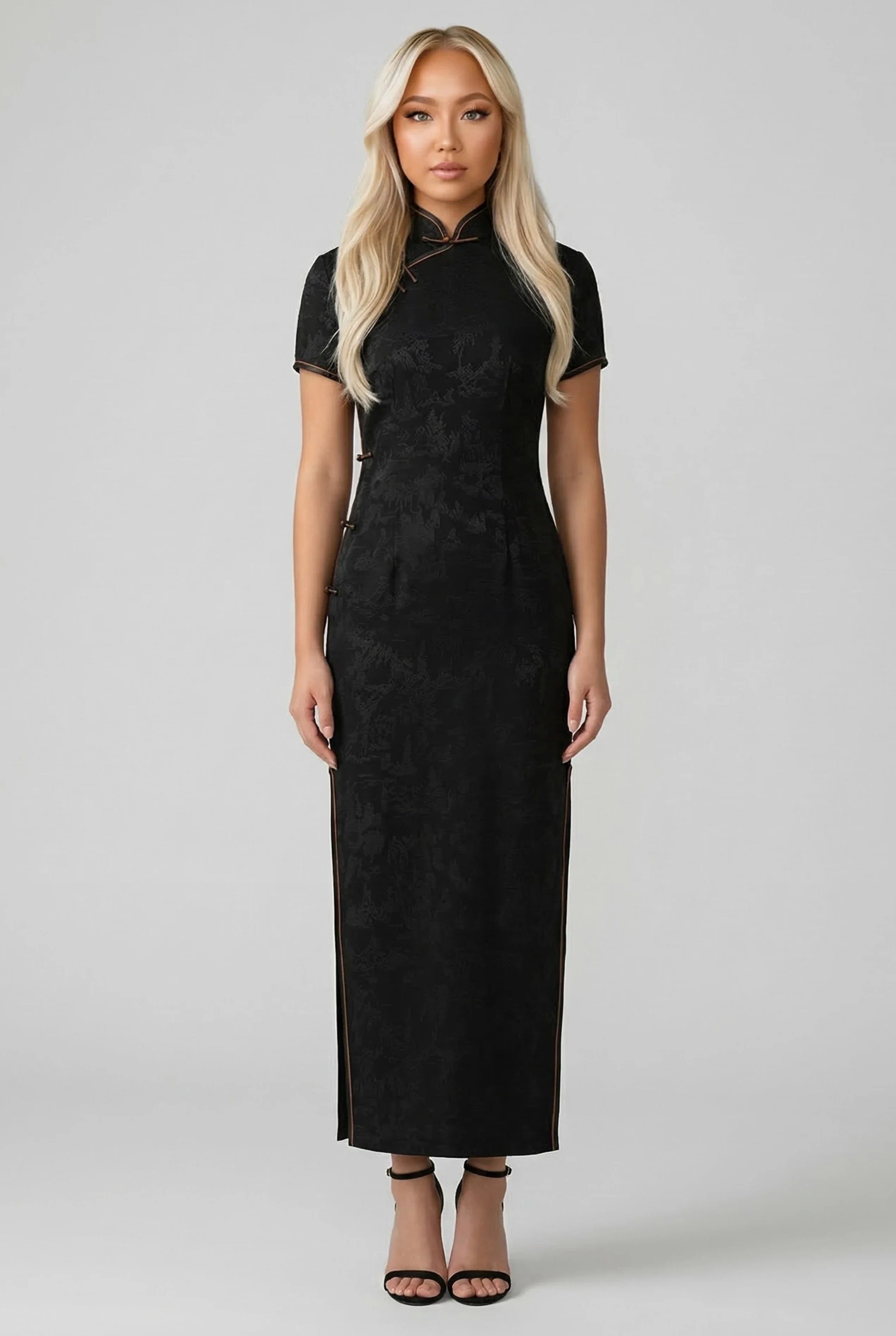 Full-length front view of an elegant black silk Qipao dress with a mandarin collar and gold-trimmed closures