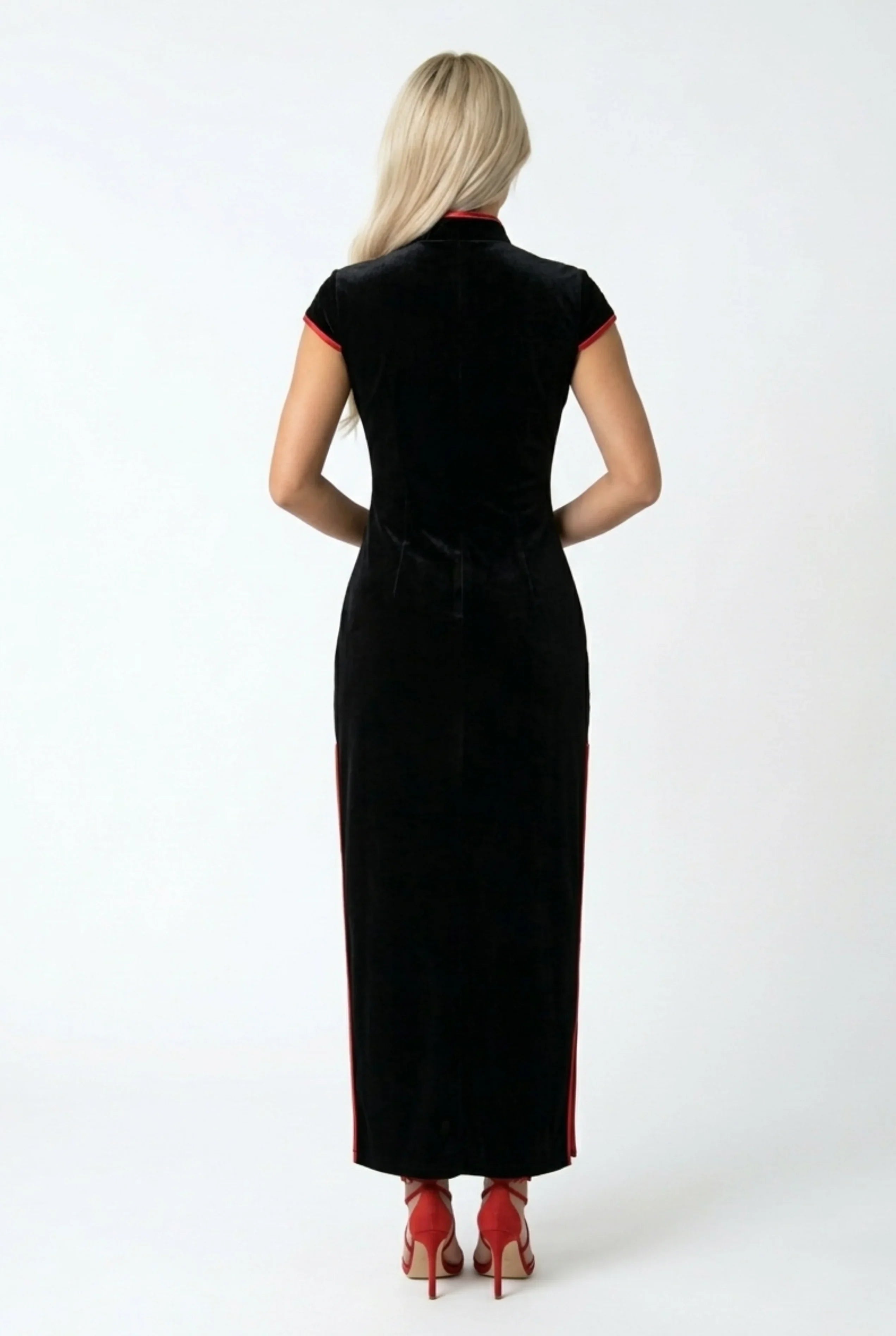 Full back view of a long black velvet Cheongsam dress showing the form-fitting silhouette.