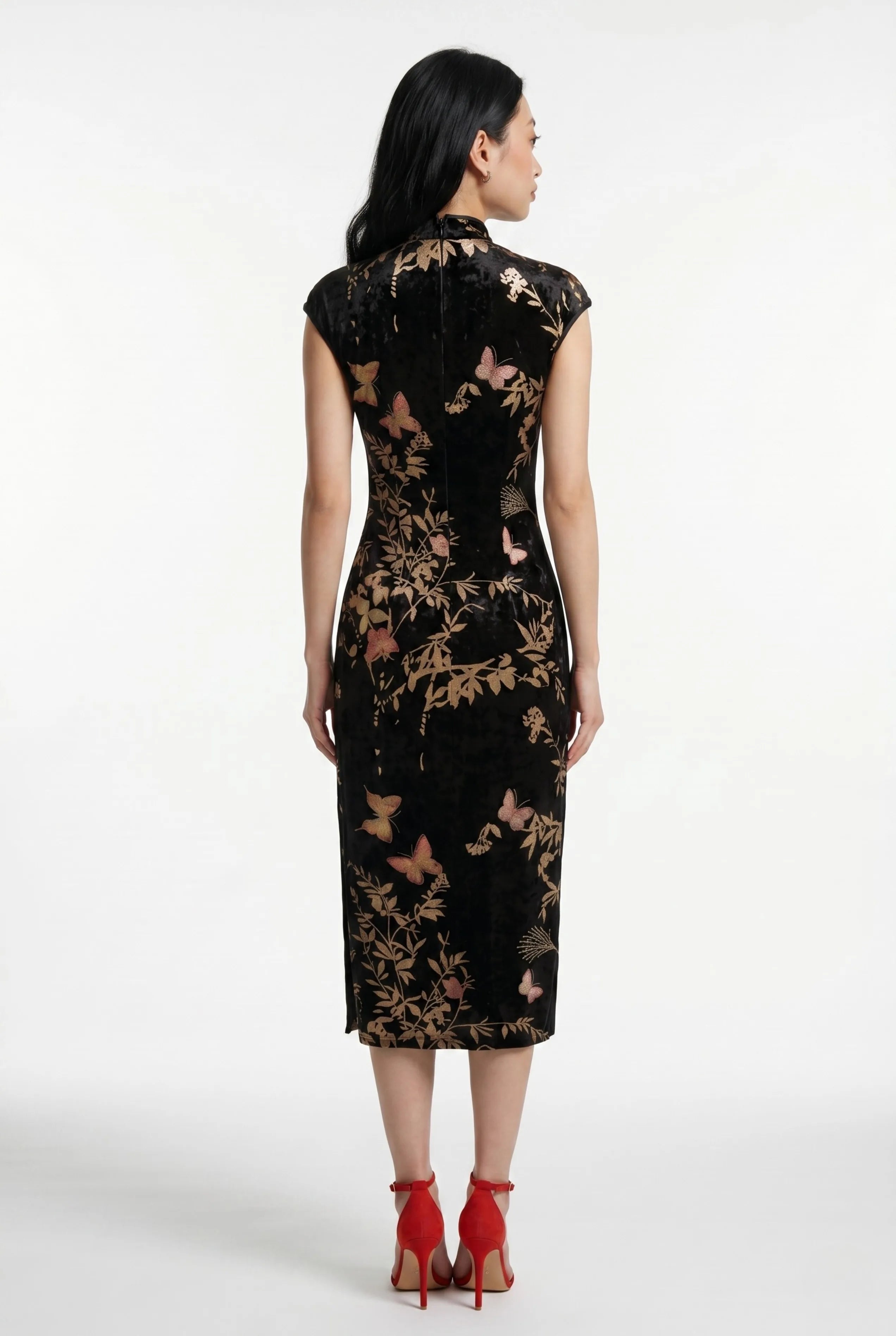 Full-length back view of the black velvet Chinese dress showing the tailored midi silhouette