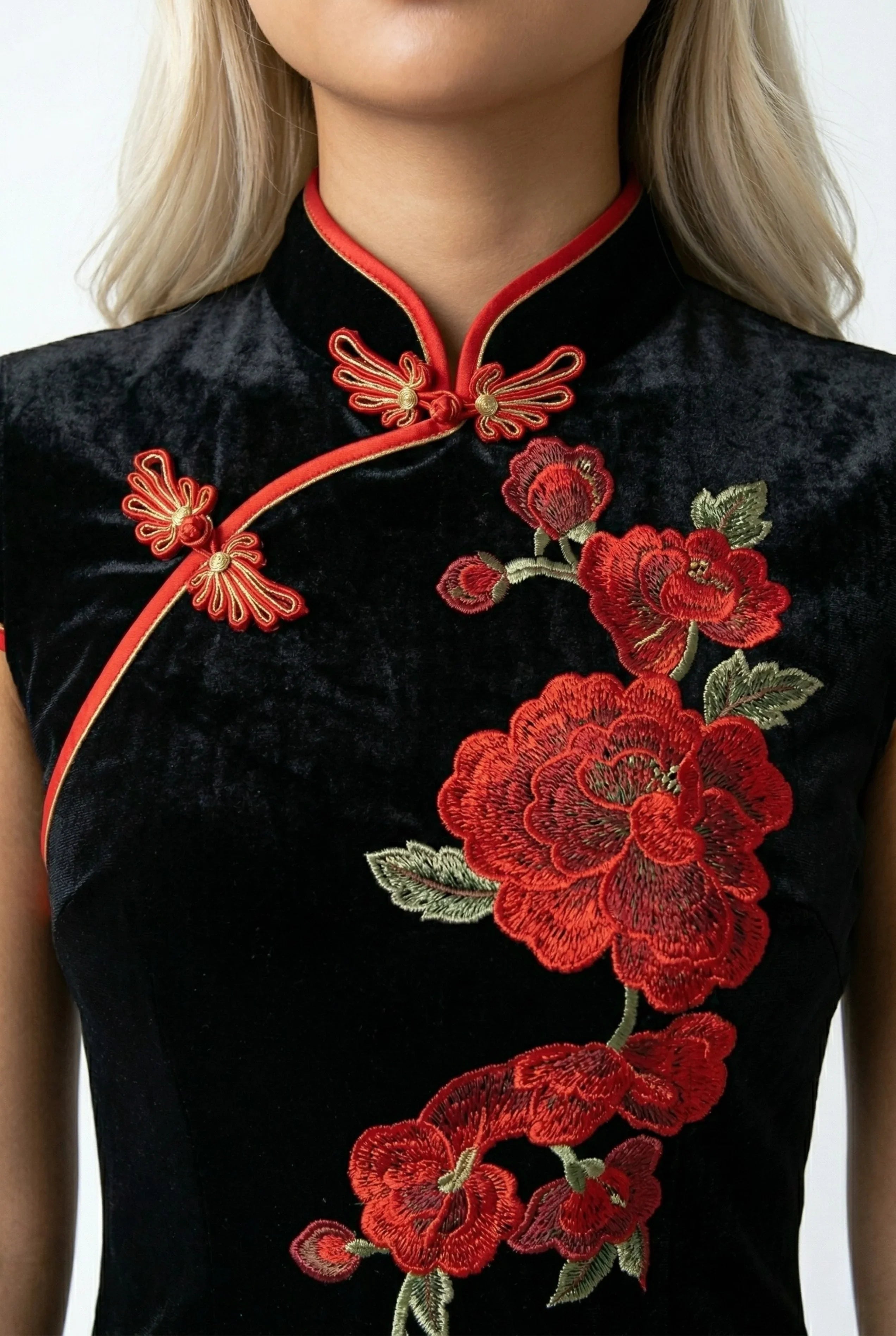 Close-up of the red peony floral embroidery and mandarin collar on a black velvet Qipao.