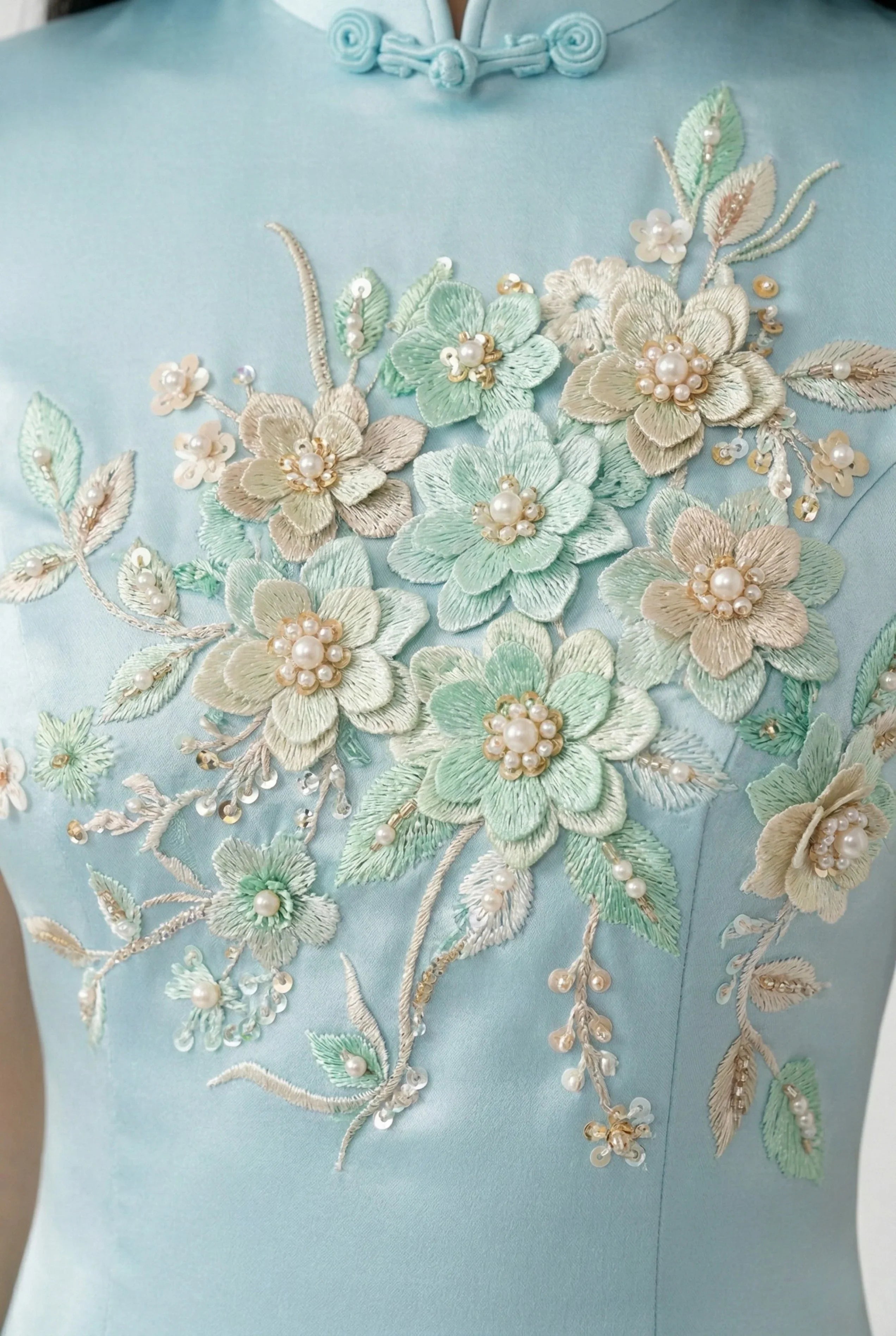 Maison Hua light blue qipao detail, floral embroidery with pearls