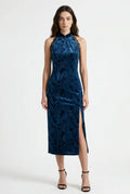 Front view of a blue velvet qipao dress with a high slit.