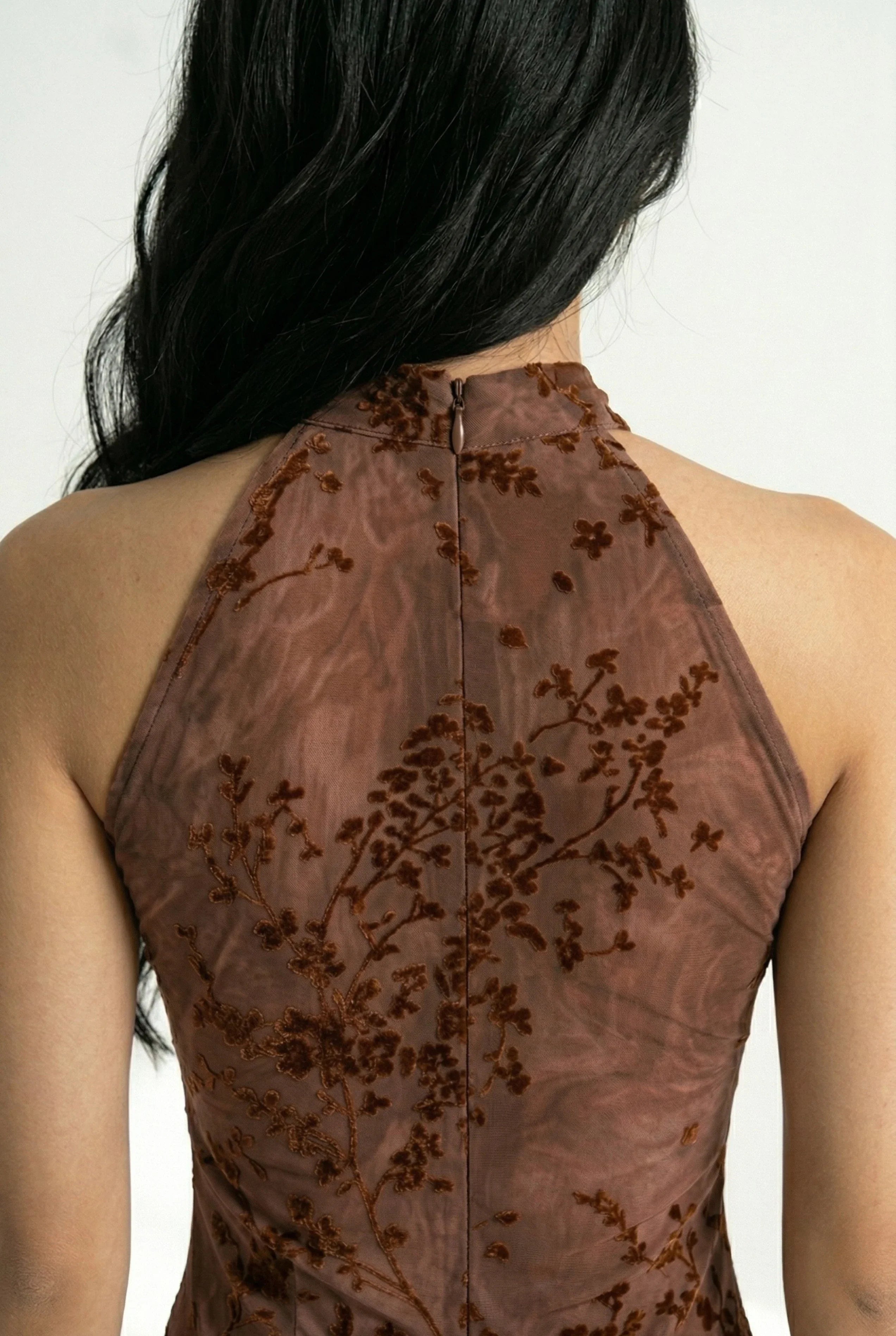 Close-up of the back zipper and fabric of the qipao.