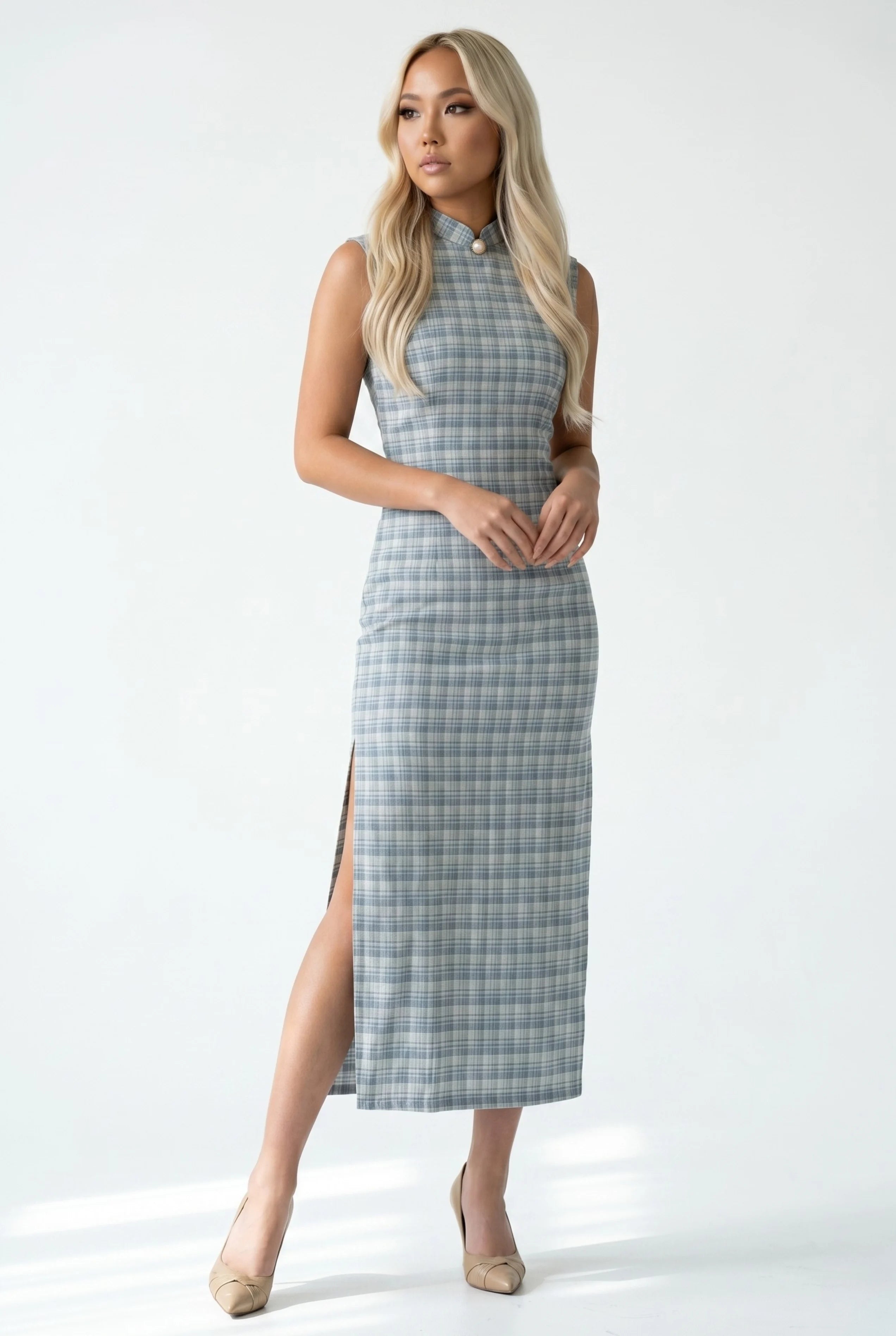 Front view of a sleeveless checkered cheongsam dress in grey plaid fabric with a high mandarin collar