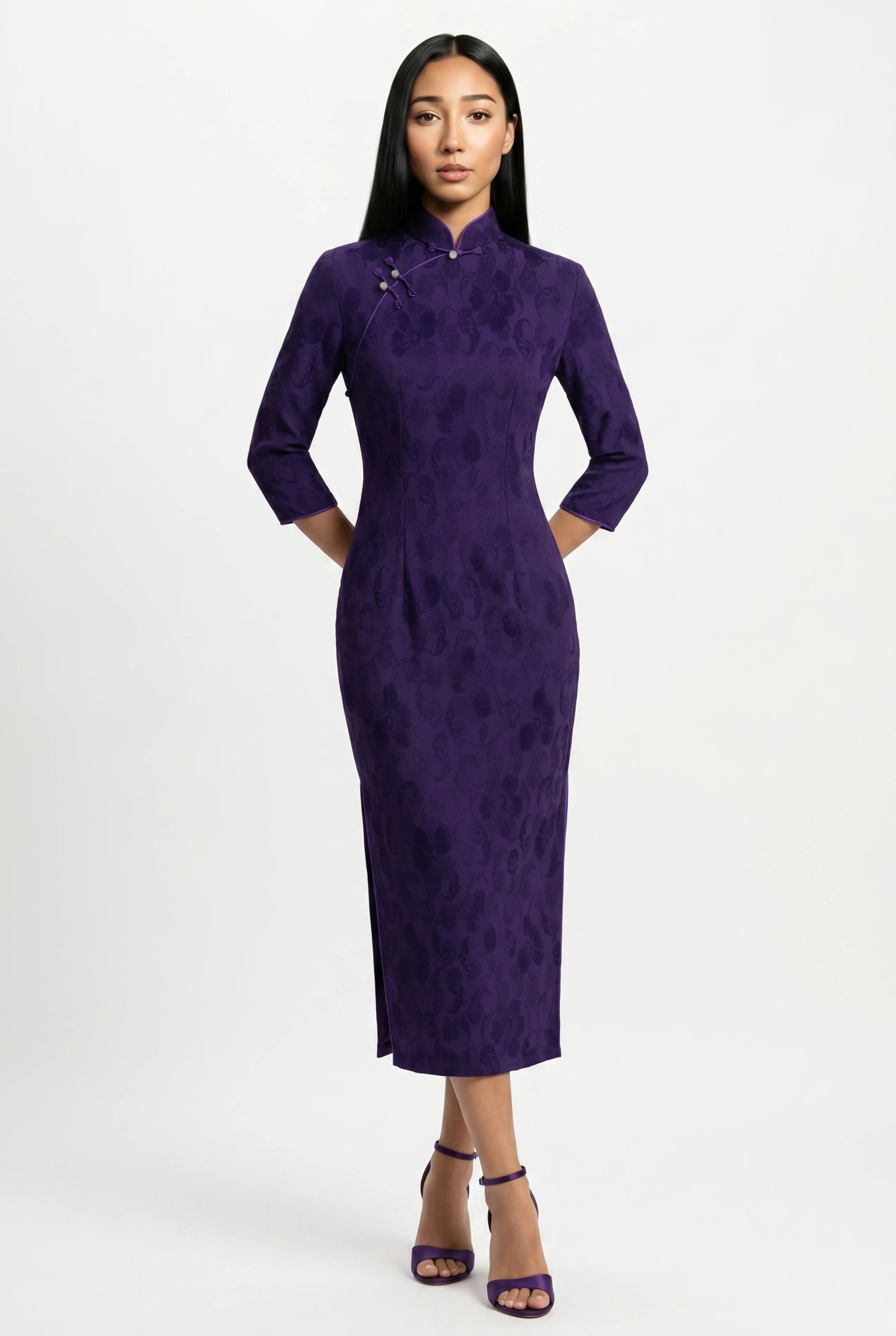 Front full-length view of a purple velvet cheongsam dress with three-quarter sleeves and matching purple heels