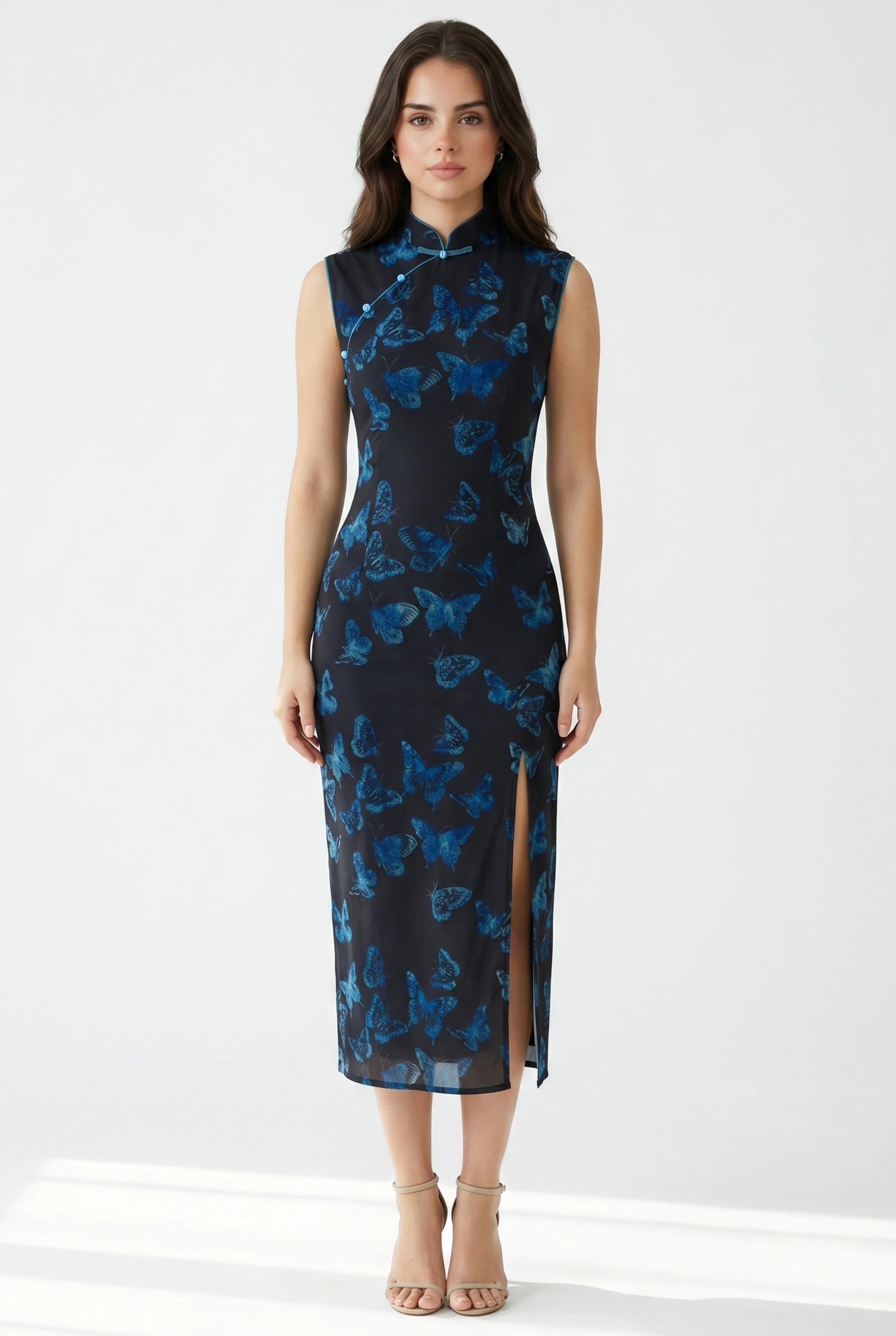 Front full-length view of a sleeveless light green Chinese butterfly dress with a tailored midi silhouette