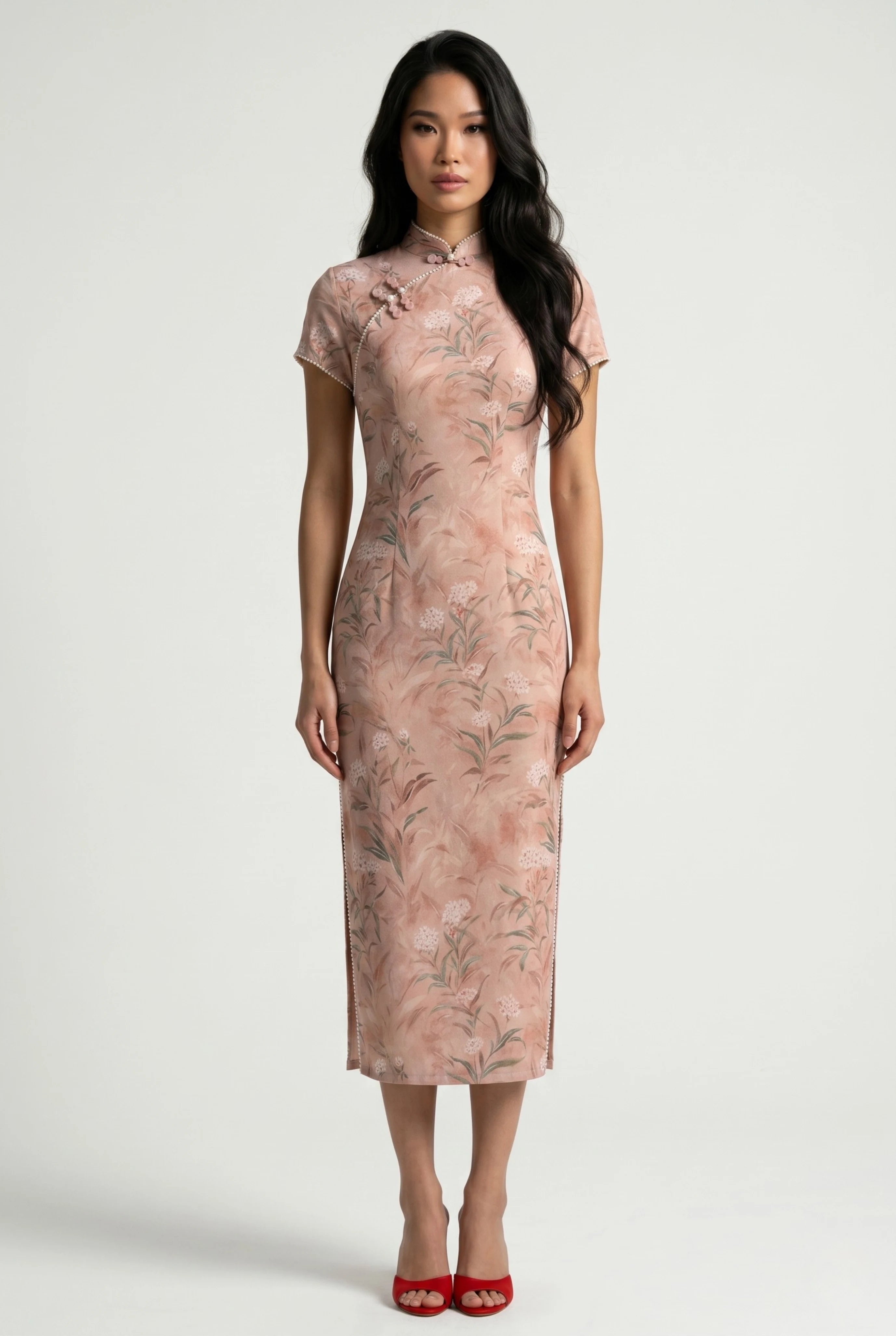 Front full-length view of a cap-sleeve pastel pink Chinese dress with a delicate floral and branch pattern, paired with red heels