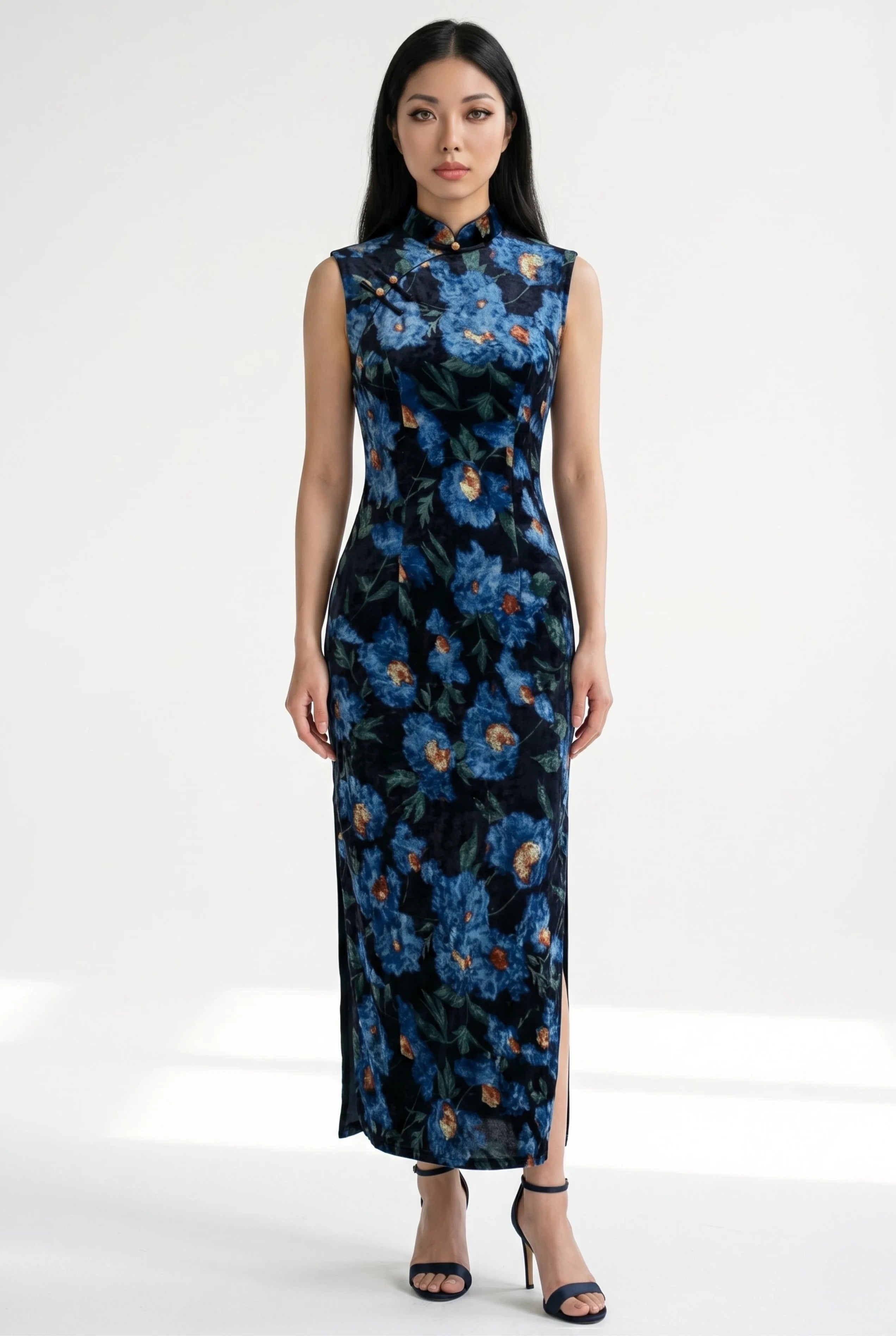 Front view of a sleeveless blue floral Chinese velvet dress with matching blue high heels