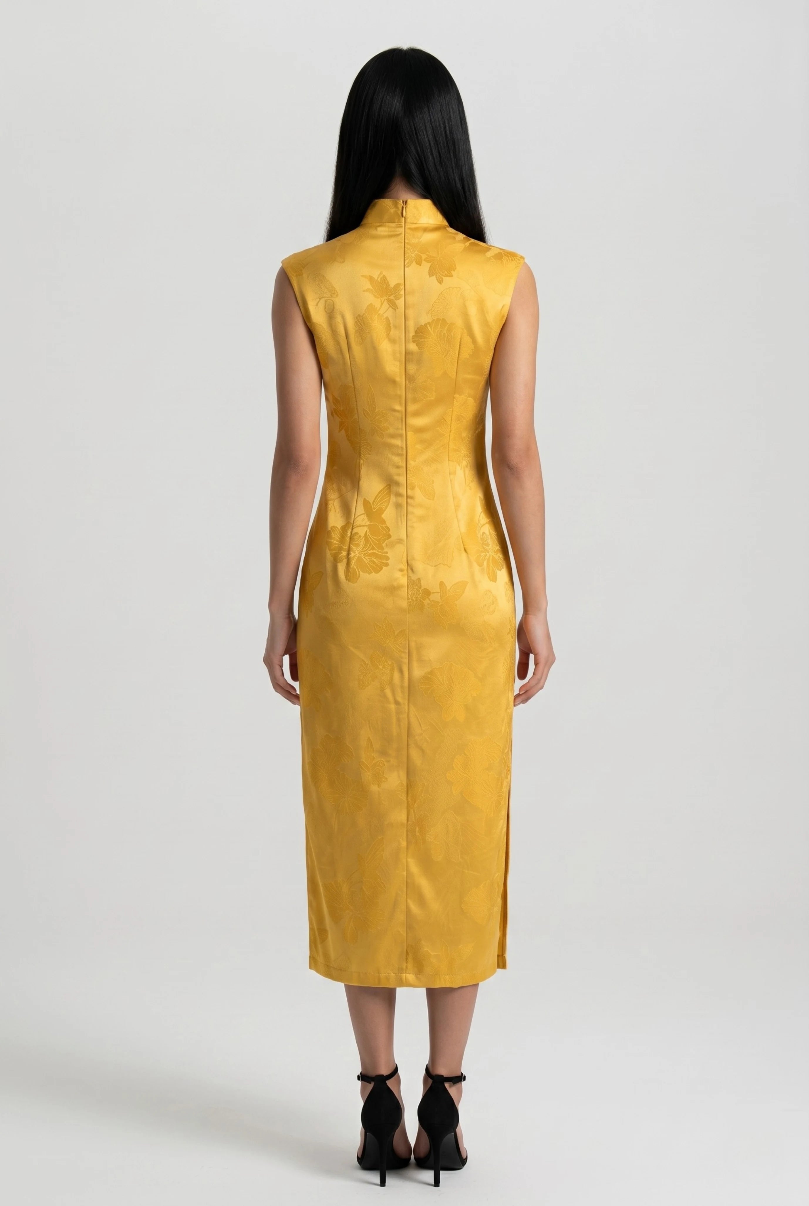 Full-length back view of the yellow velvet Chinese dress showing the tailored midi silhouette