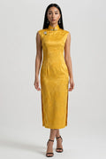 Front full-length view of a sleeveless yellow velvet Chinese dress with a keyhole neckline and mandarin collar