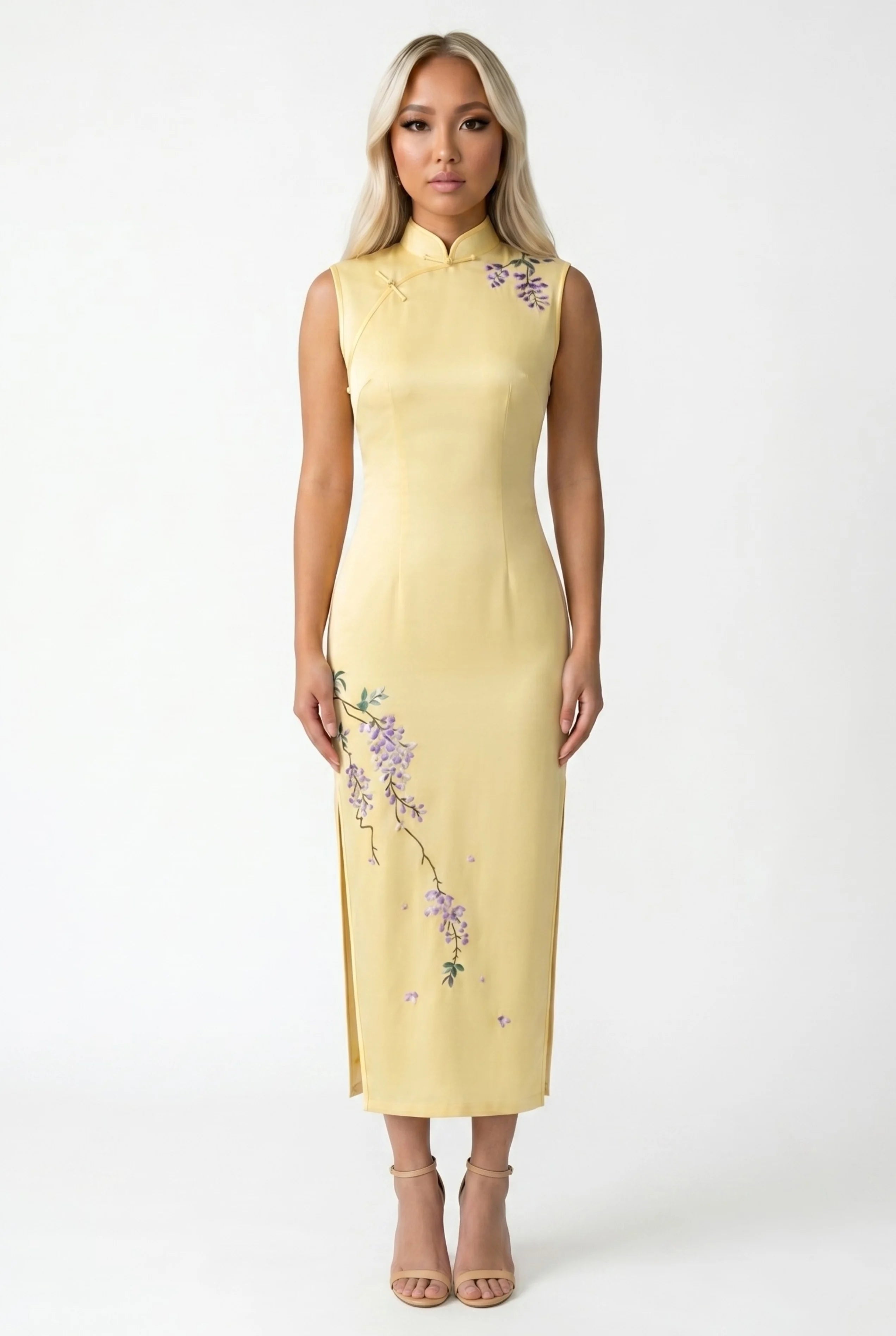 Front full-length view of a sleeveless yellow Chinese qipao dress featuring delicate purple floral embroidery
