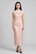 Front full-length view of a pink satin Chinese style dress with white lace trim and cap sleeves