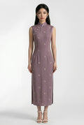 Front view of a sleeveless Chinese style purple dress with a slim silhouette and delicate gold embroidery.
