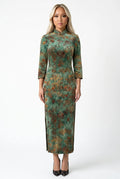 Front full-length view of a green floral velvet Chinese traditional vintage qipao dress with three-quarter sleeves