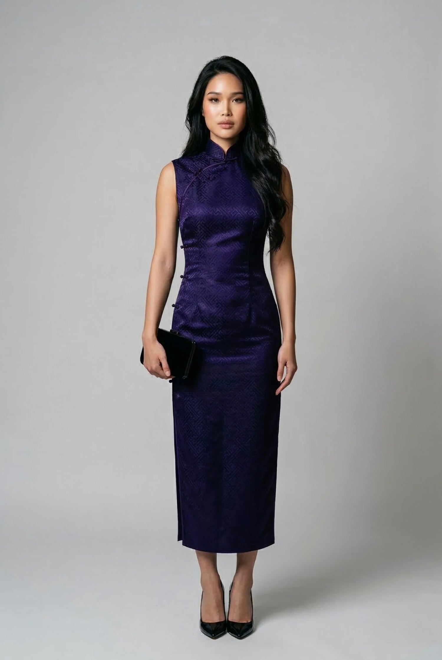 A model wearing a deep purple sleeveless silk brocade cheongsam by Maison Hua, showcasing a high Mandarin collar and a sophisticated, structured silhouette for formal events
