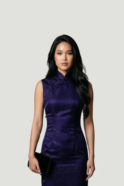 A model wearing a deep purple sleeveless silk qipao by Maison Hua, featuring a subtle textured pattern and a traditional high Mandarin collar