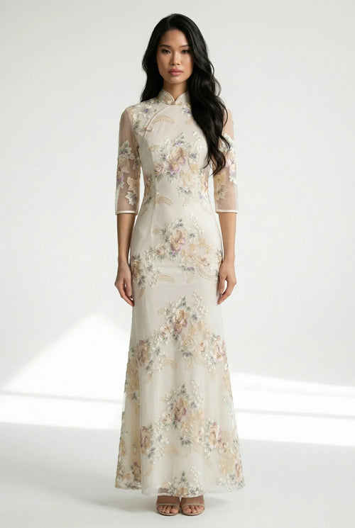 Front full view of a beige Chinese dress with floral embroidery.