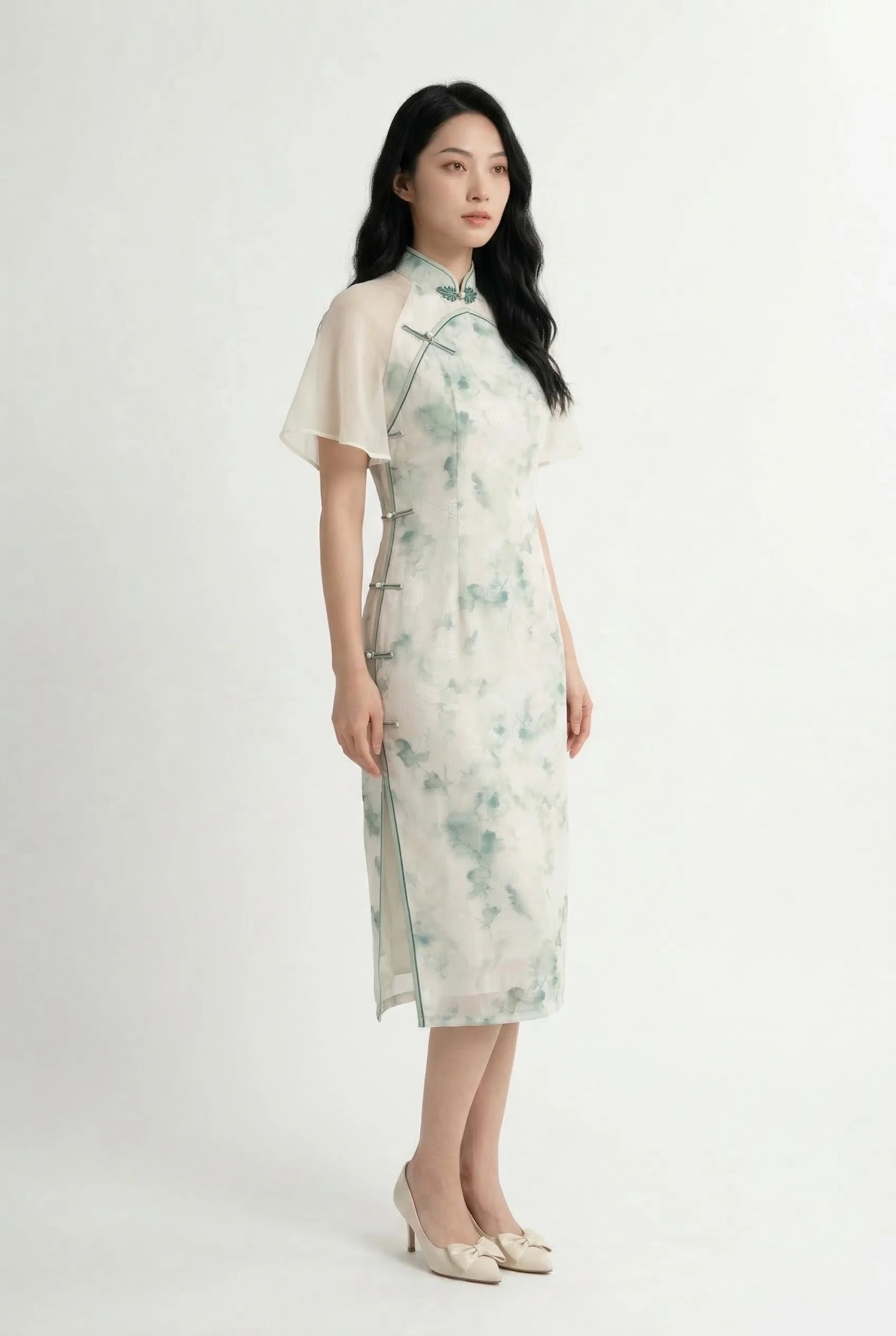 Side profile of a floral ink wash Cheongsam dress showing the elegant drape of the sheer angel sleeves and midi length.