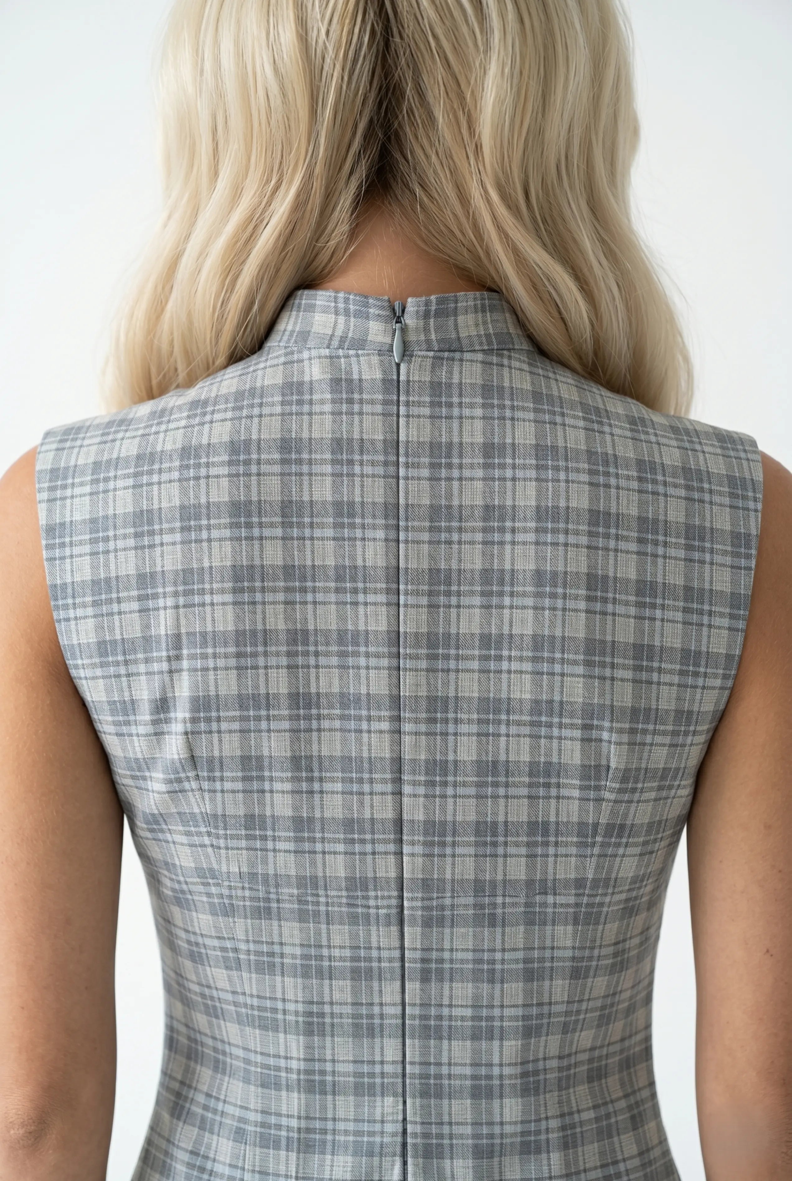 Close-up back view showing the clean zipper closure and high collar structure of the grey plaid qipao dress