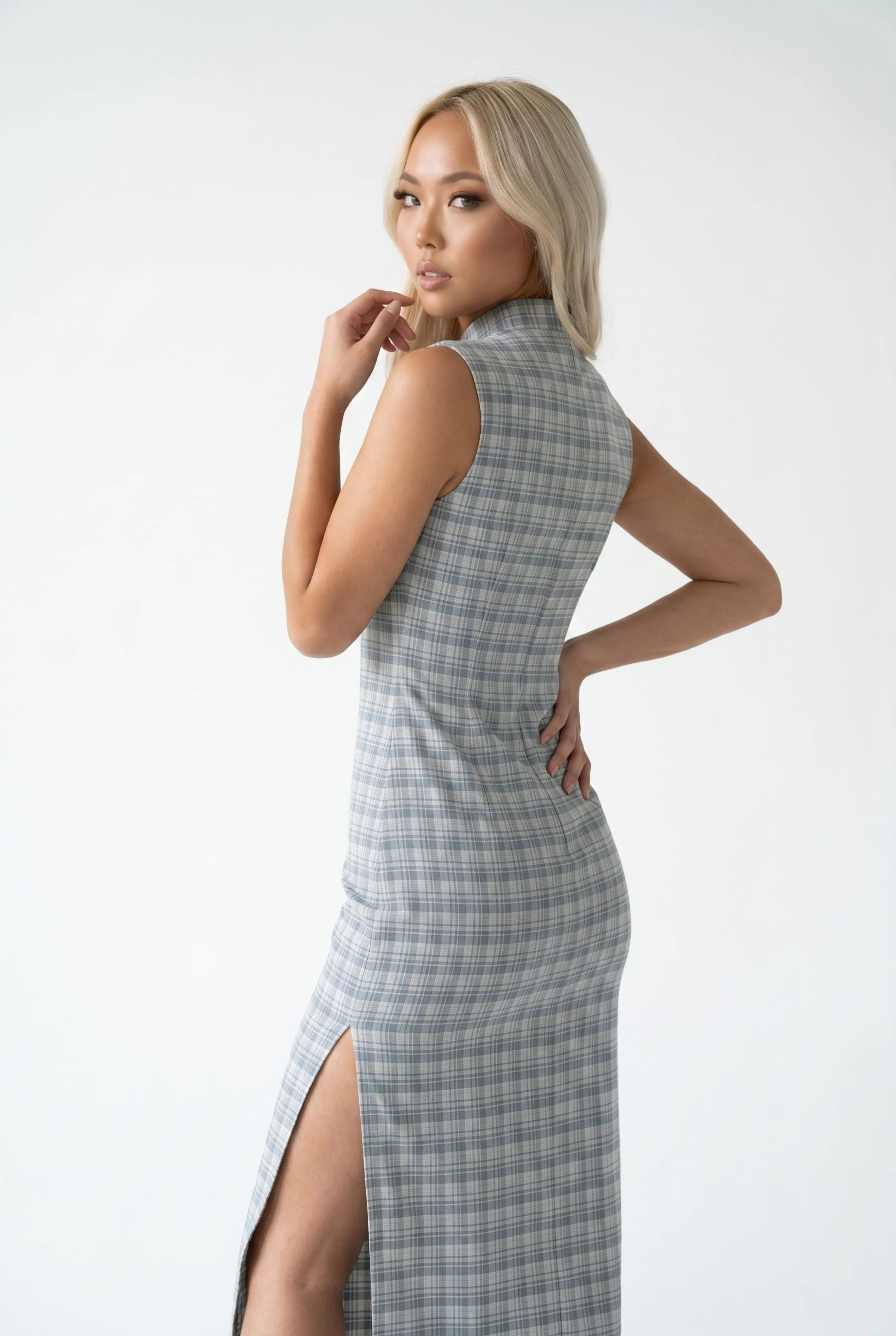 Three-quarter back view of the grey plaid qipao dress highlighting the form-fitting design