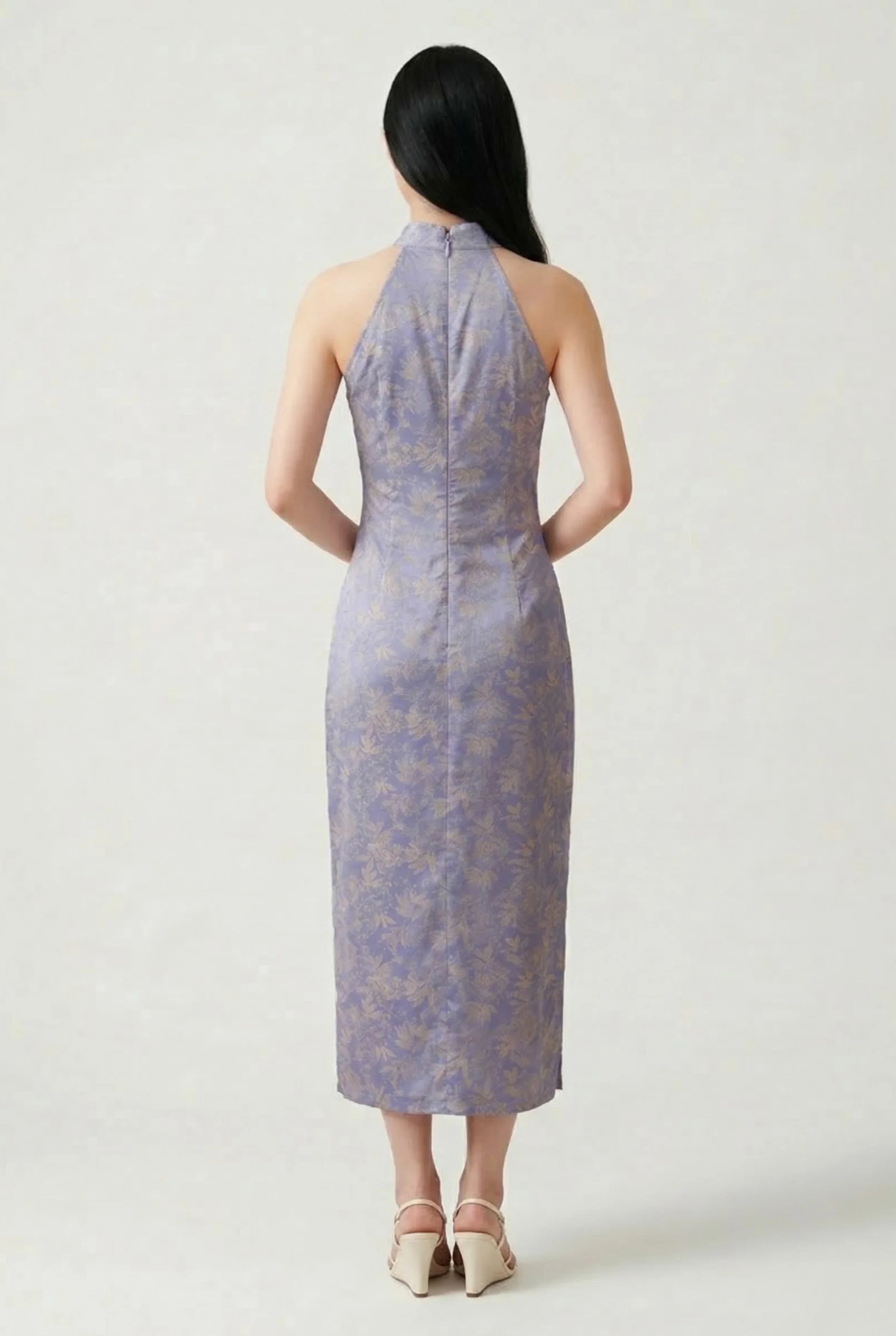 Back view of a lavender halter neck Cheongsam showing the elegant floral brocade pattern and long cut.