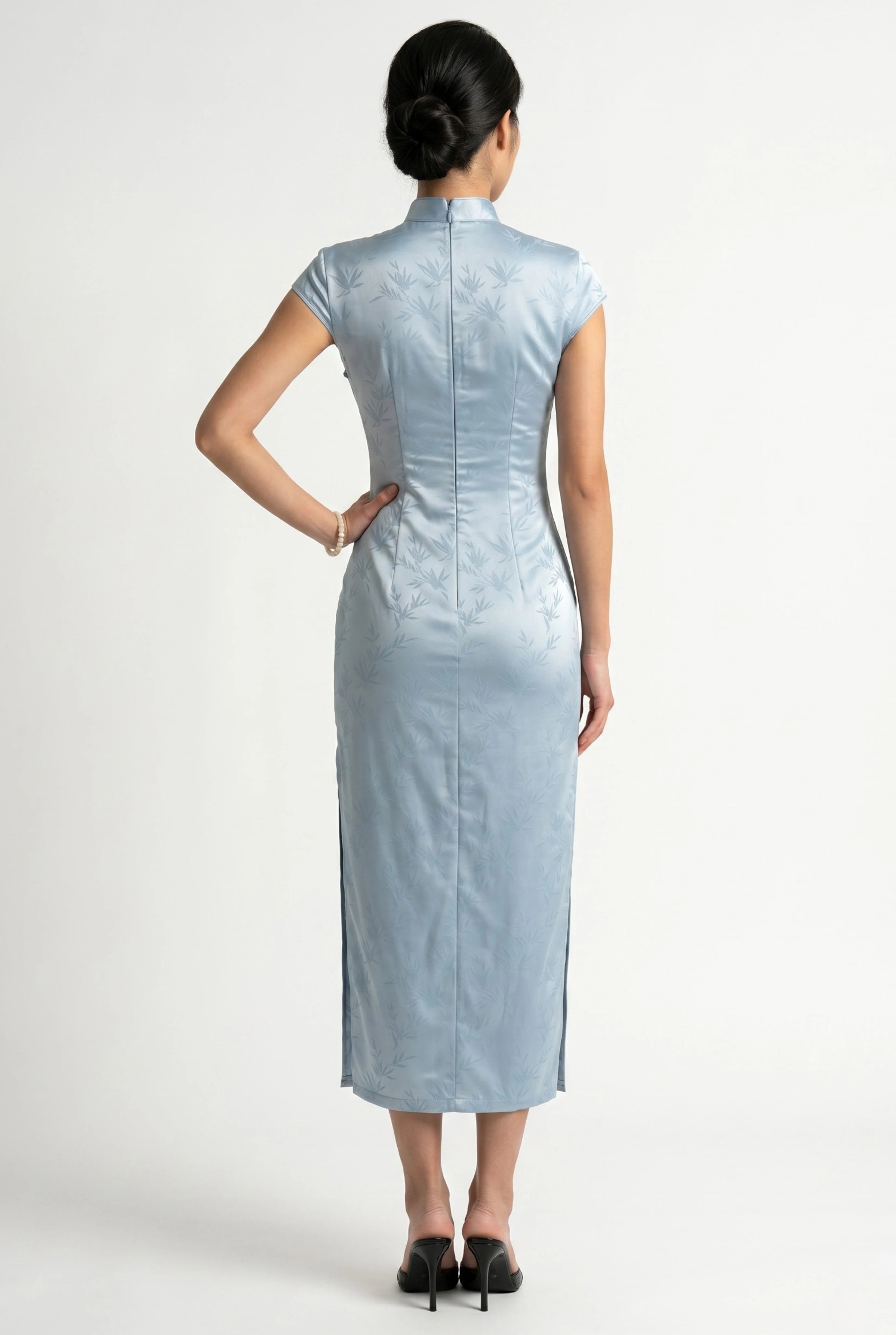 Back view of the ankle-length light blue cheongsam showing the sleek, tailored silhouette