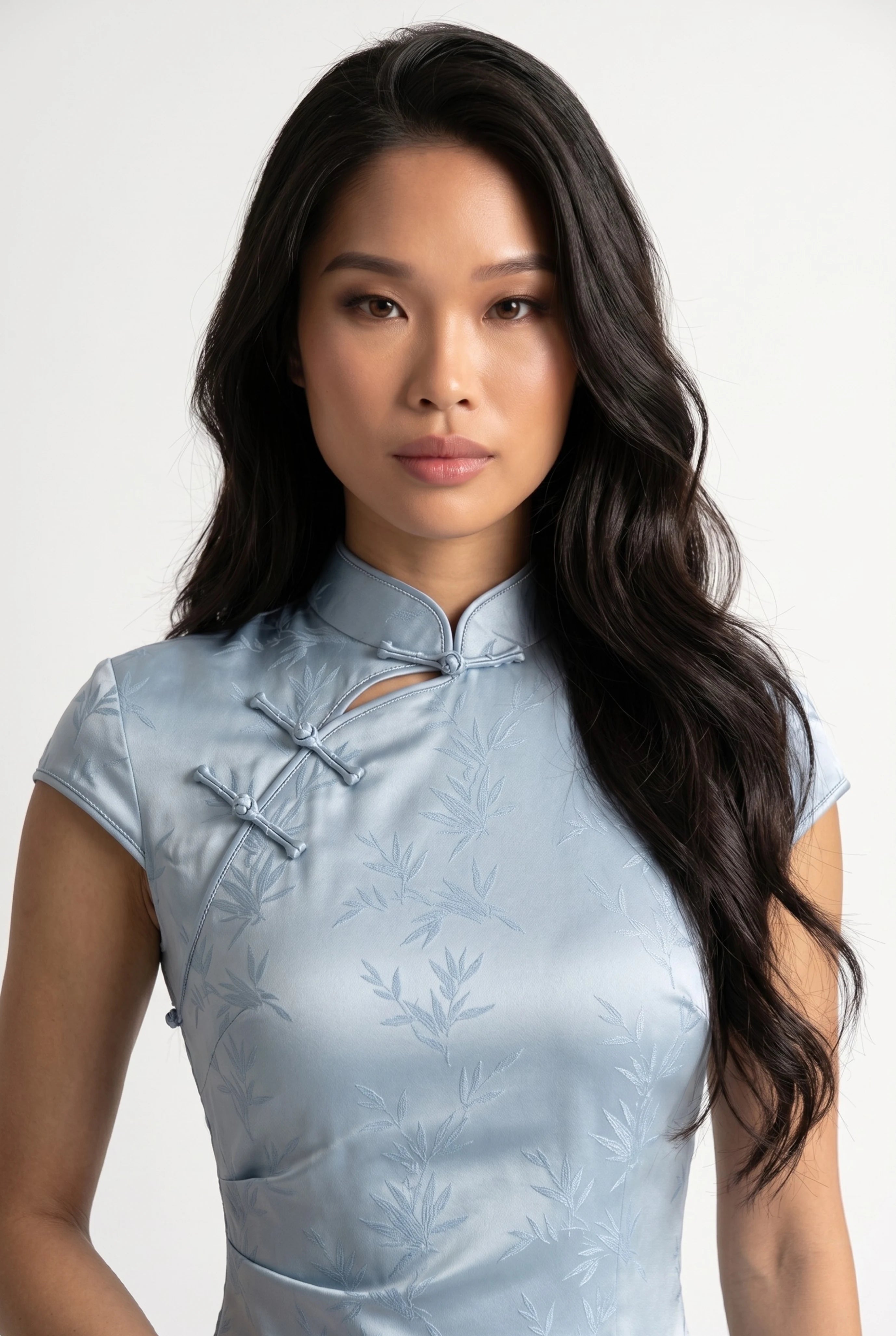 Close-up front view of the high mandarin collar, keyhole detail, and traditional frog buttons
