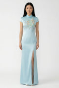 Maison Hua light blue silk qipao with floral embroidery, front view.