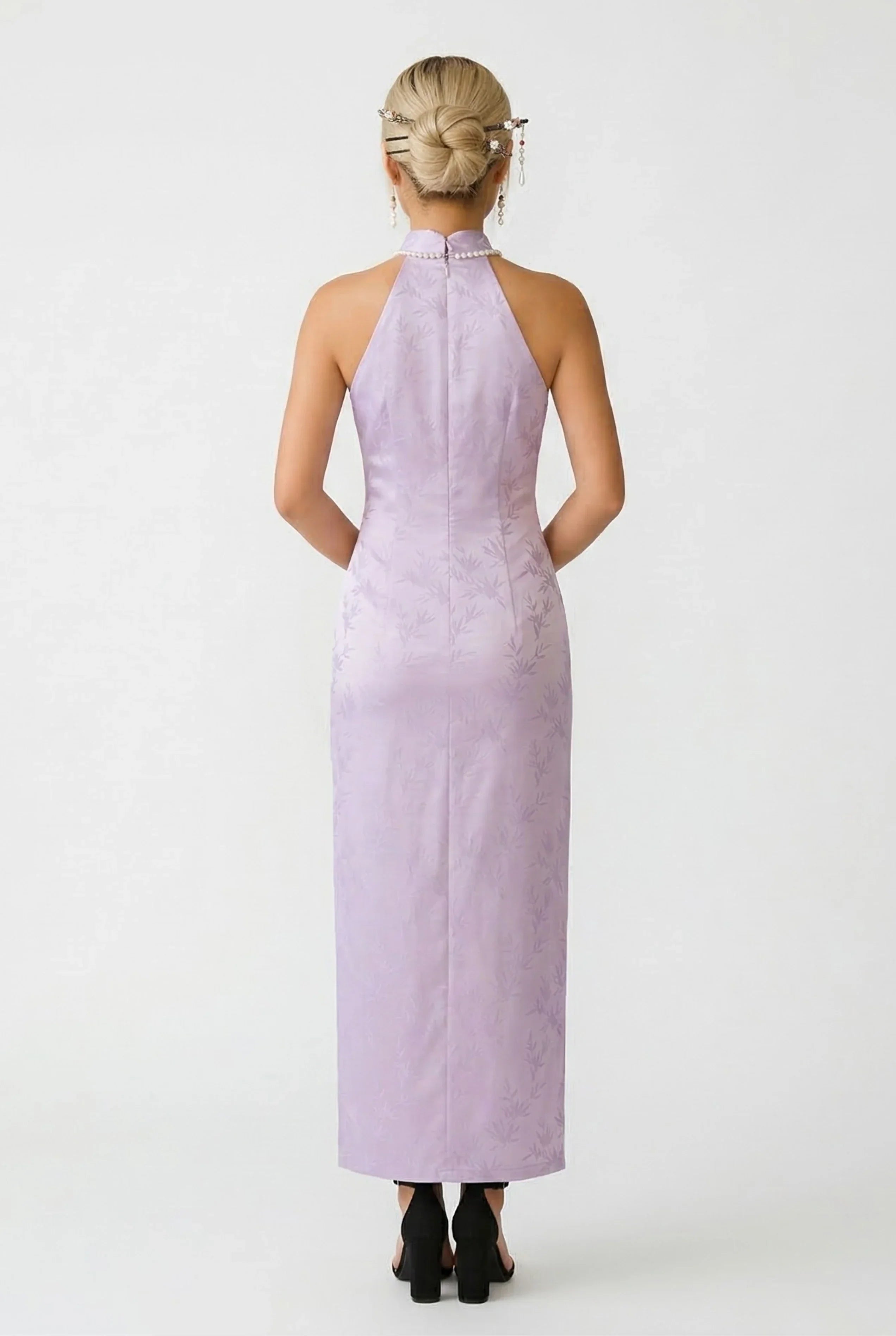 Back view of a long lilac Cheongsam dress highlighting the halter-neck design and sleek form-fitting silhouette.