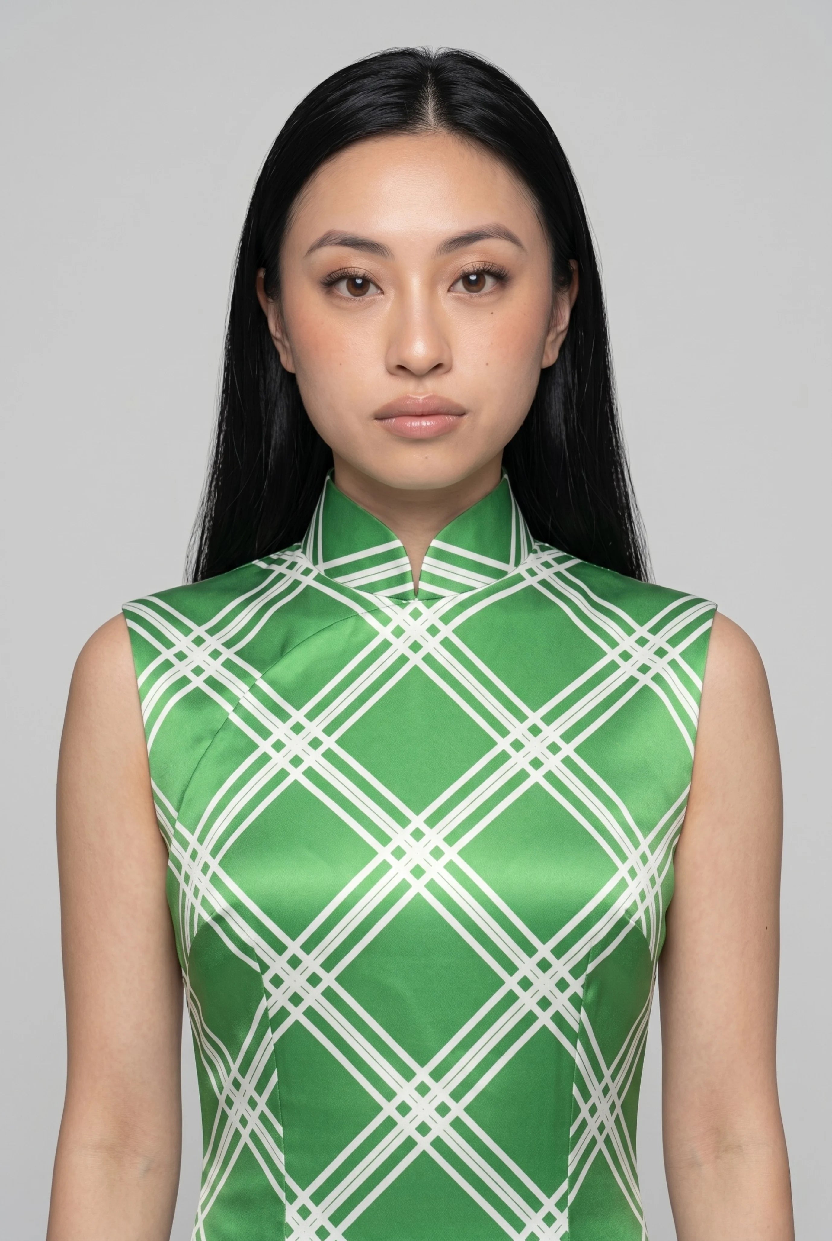 Close-up front view highlighting the high mandarin collar and the vibrant white and lime green diamond pattern on the bodice
