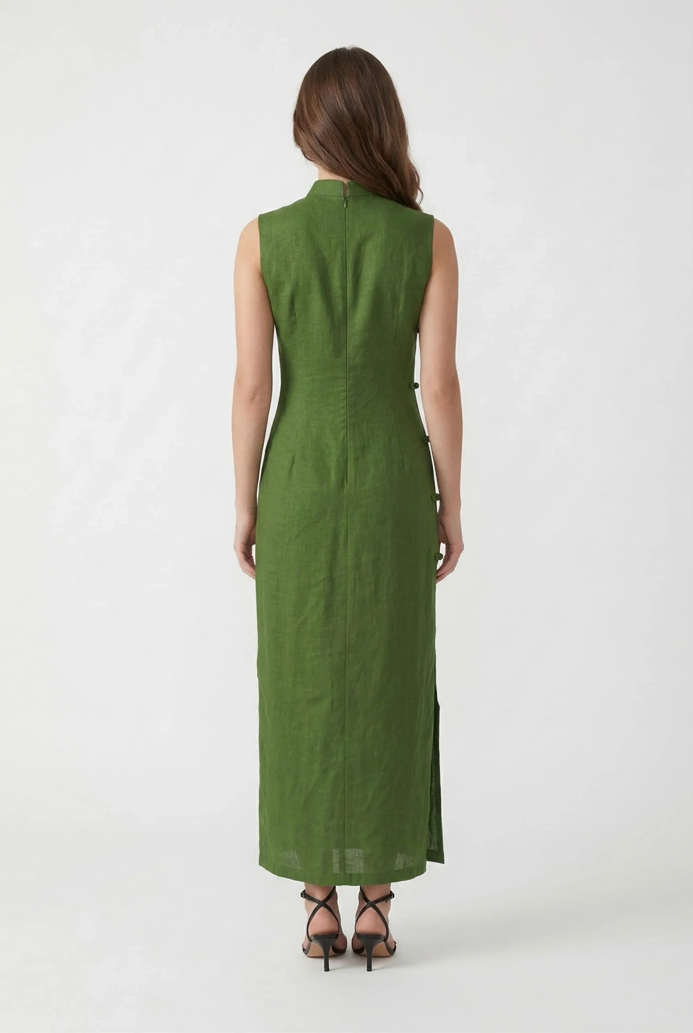 Back view of a minimalist green linen Cheongsam dress, highlighting the natural fabric drape and sleek back zipper.