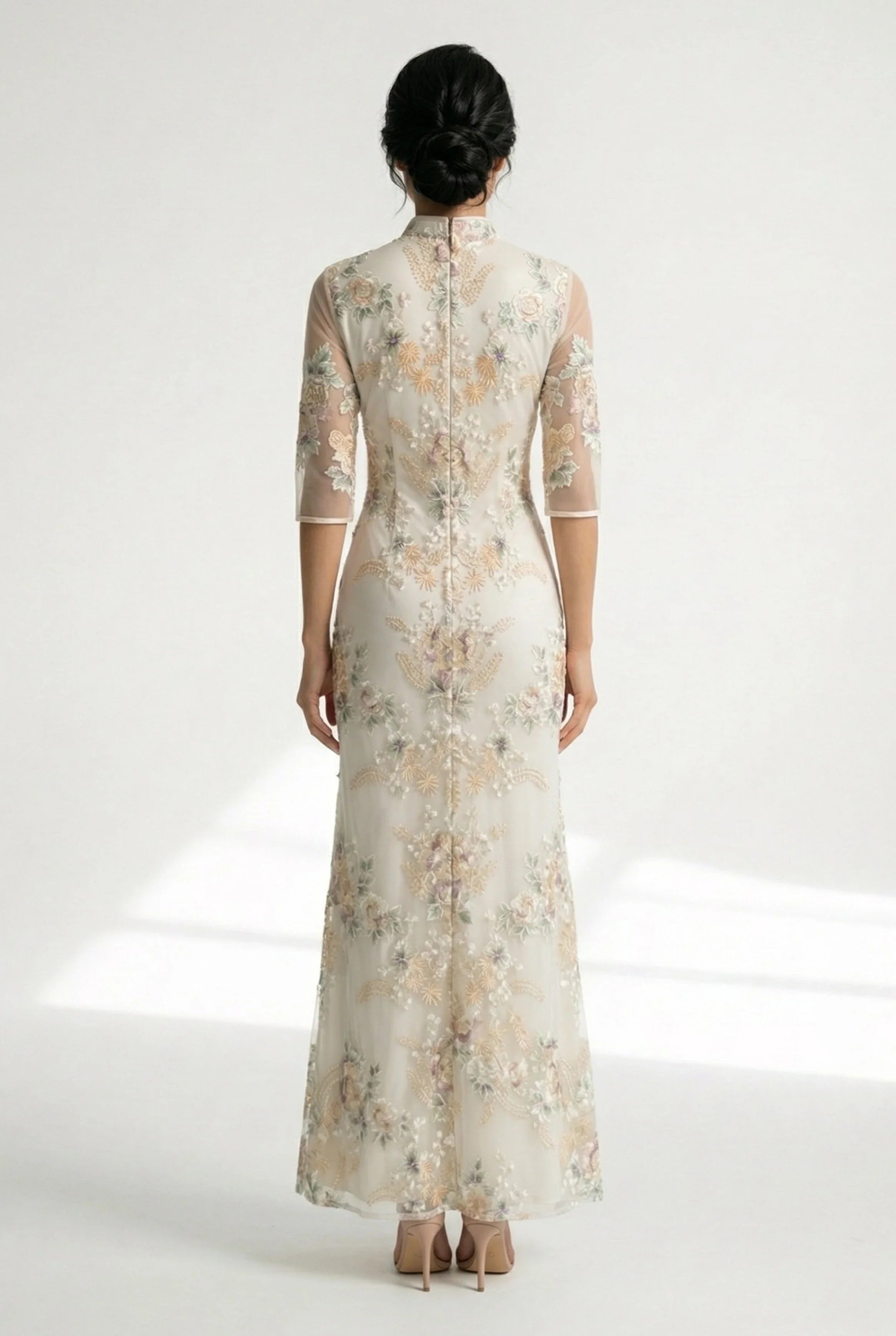 Side profile of the beige Chinese dress with sheer mid-length sleeves.