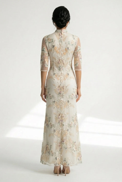 Side profile of the beige Chinese dress with sheer mid-length sleeves.