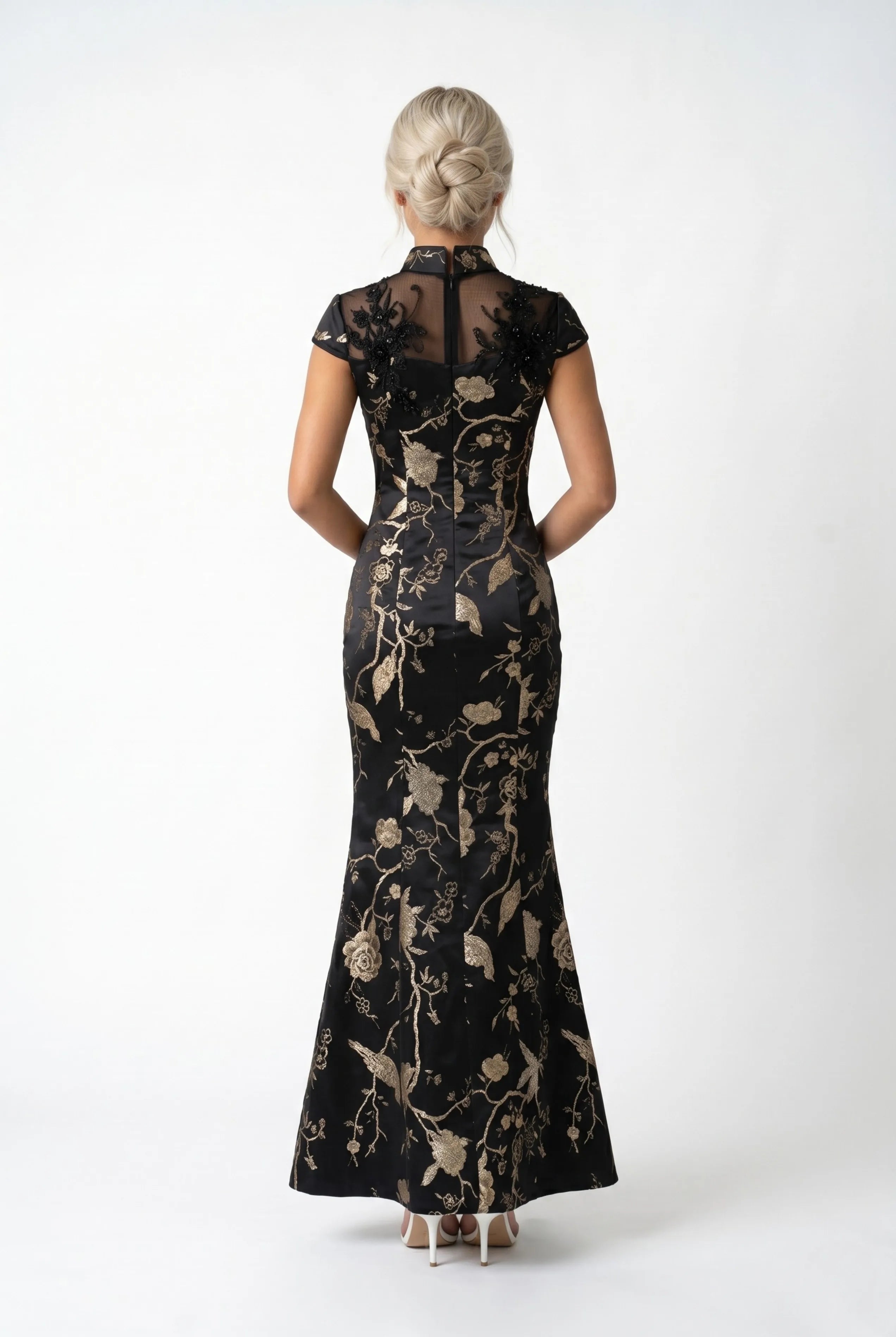 Full-length back view of the long black cheongsam dress showcasing its flared mermaid train