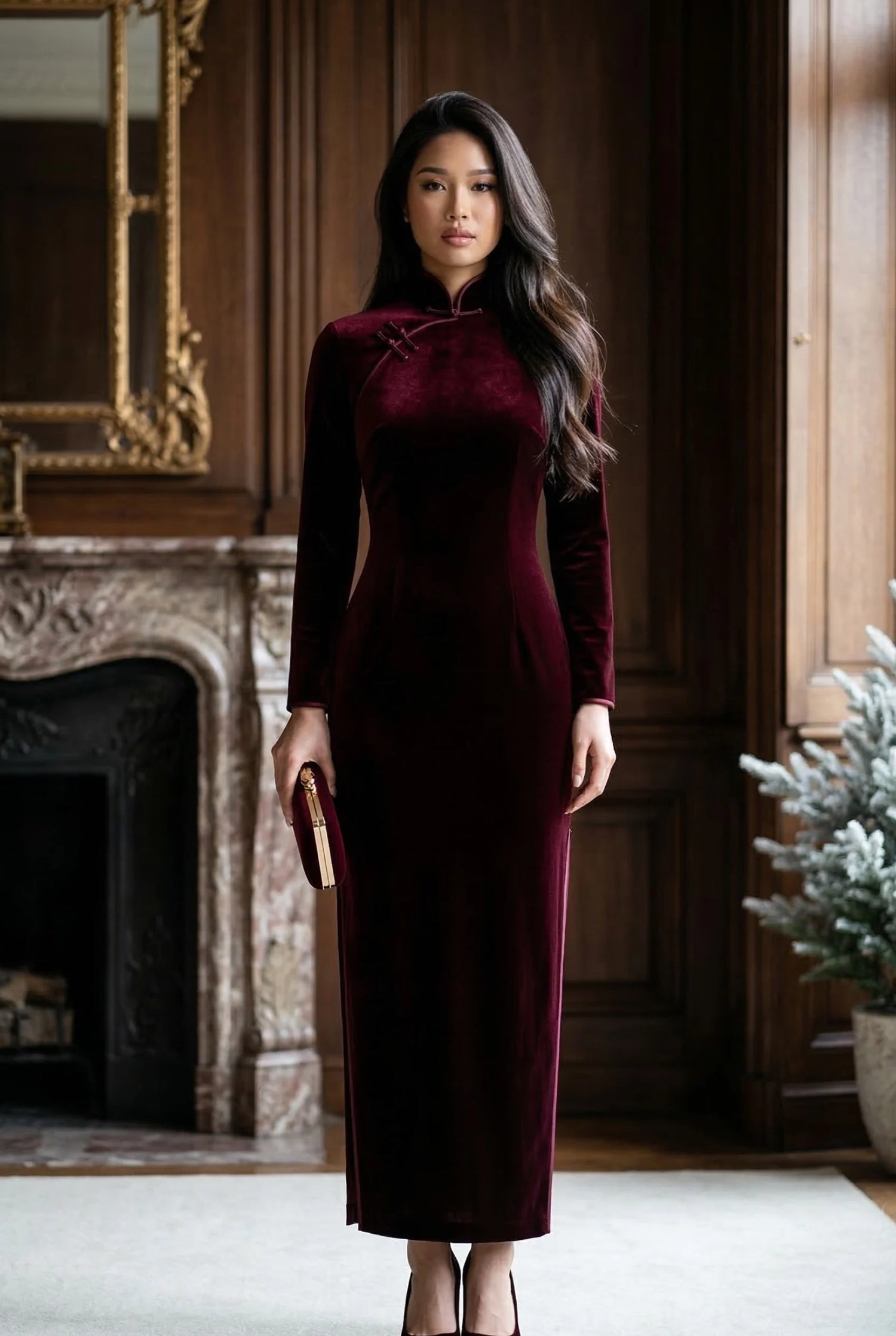Full-length burgundy velvet cheongsam with long sleeves and a high Mandarin collar, showcasing the structural integrity and architectural profile of Maison Hua's winter collection