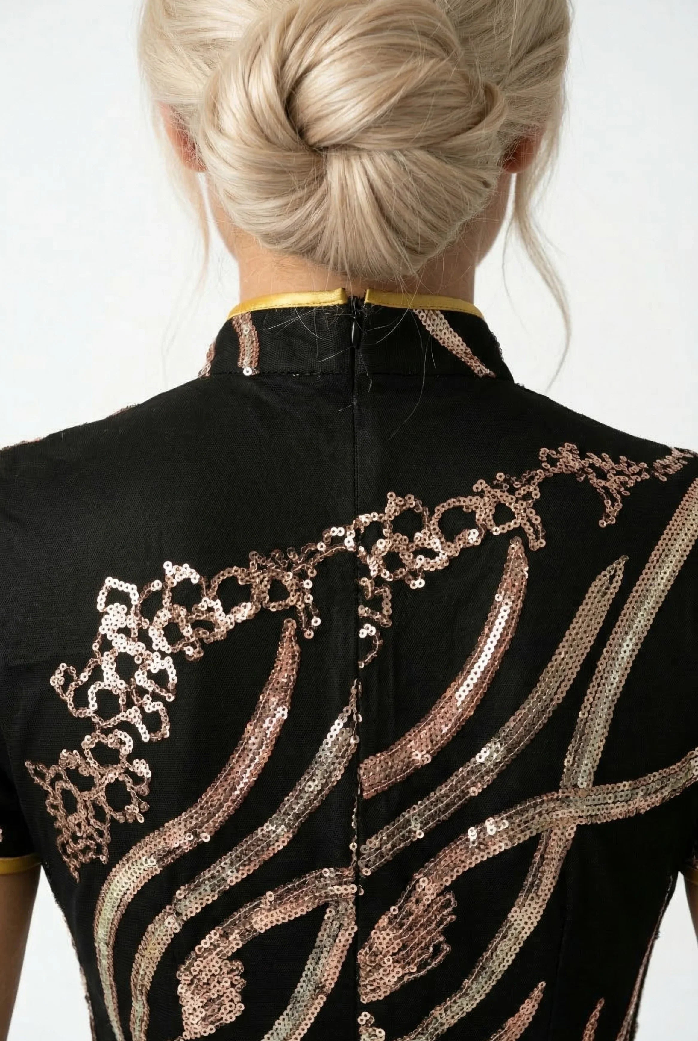 Detailed shot of the back collar and golden sequin embroidery on the nape of a black luxury high-end Cheongsam.