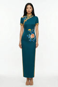 Maison Hua teal modern qipao with yellow trim and floral embroidery