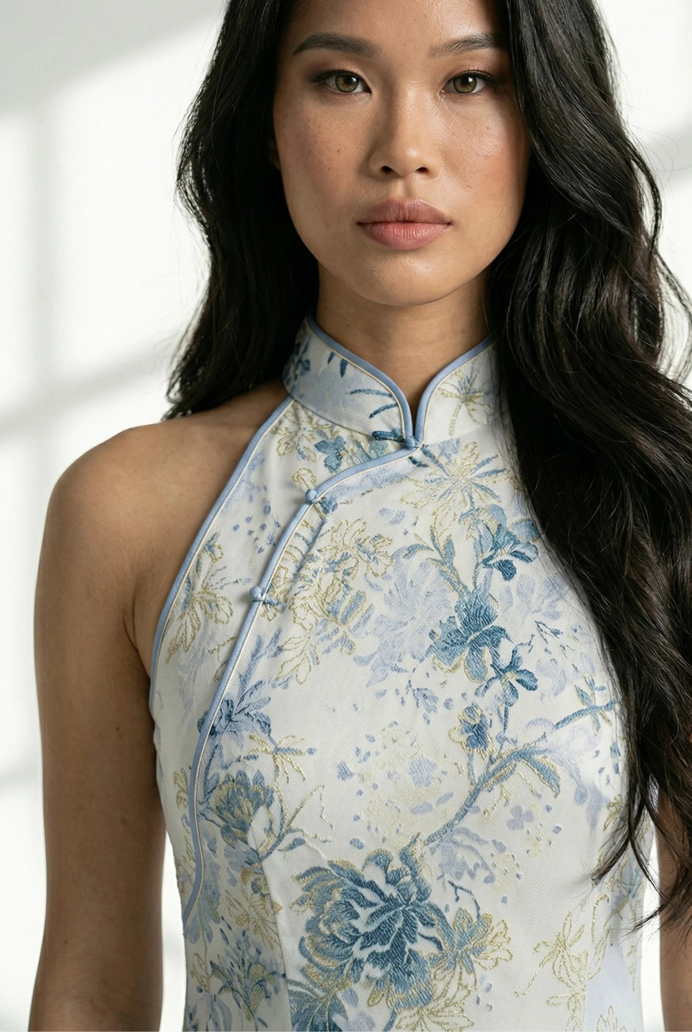 Close-up of the high mandarin collar on the floral pattern dress.