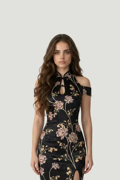 Modern black floral qipao by Maison Hua featuring a cold-shoulder design, keyhole neckline, and a traditional Mandarin collar