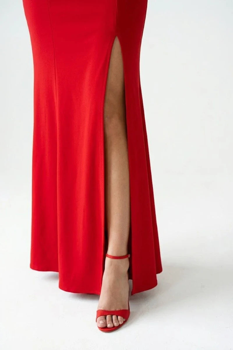 Detail of thigh-high side slit on a modern red qipao