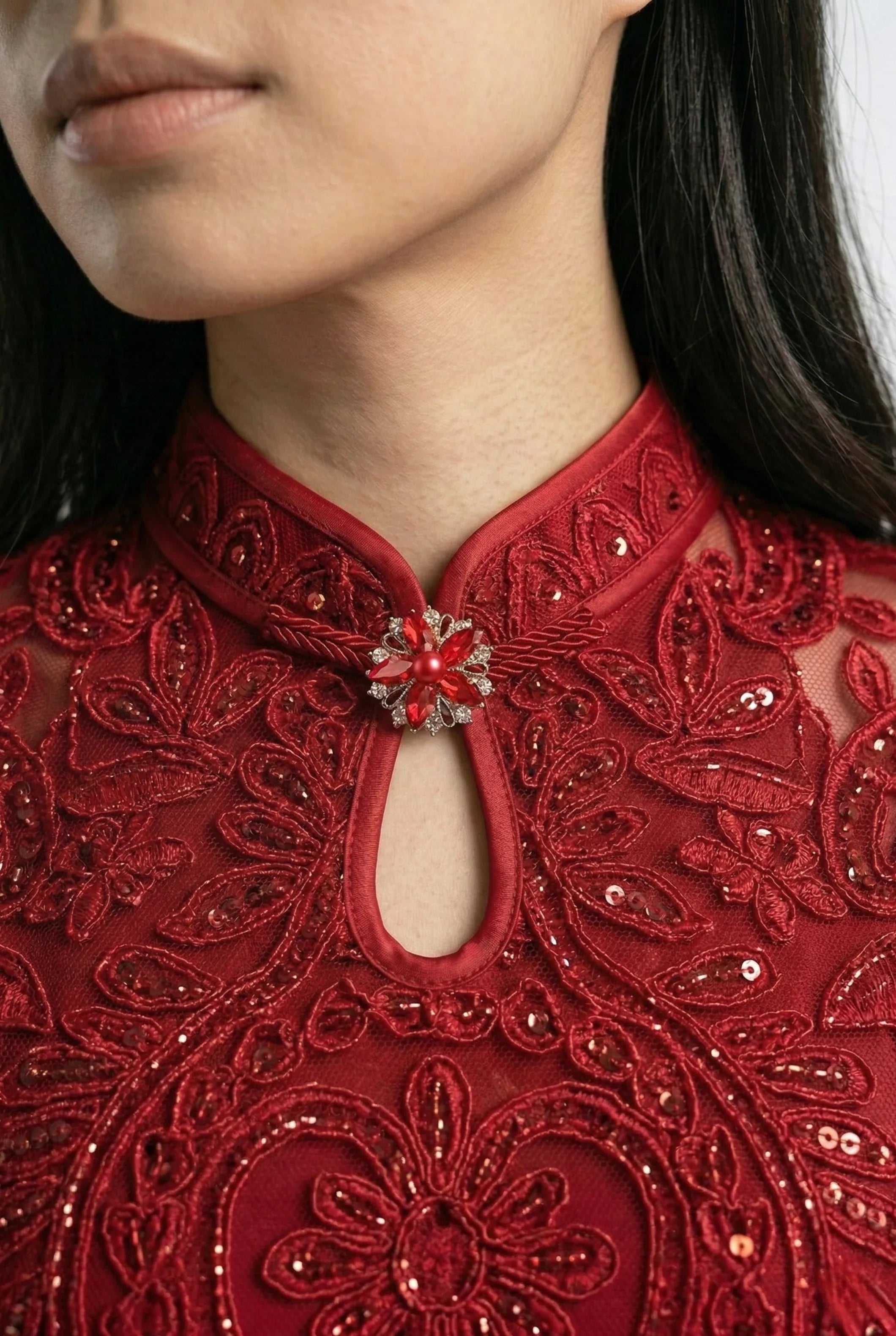 Maison Hua modern qipao detail, red lace collar and crystal brooch