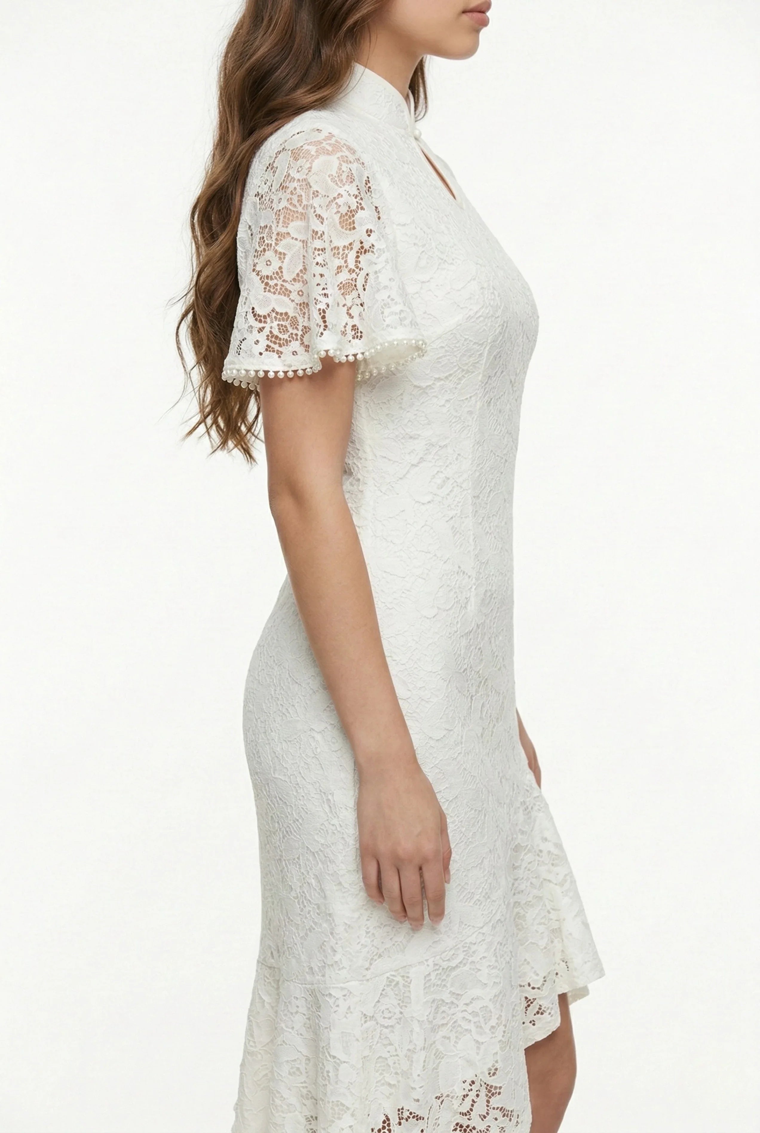 Side profile of a modern white lace qipao with flared bell sleeves